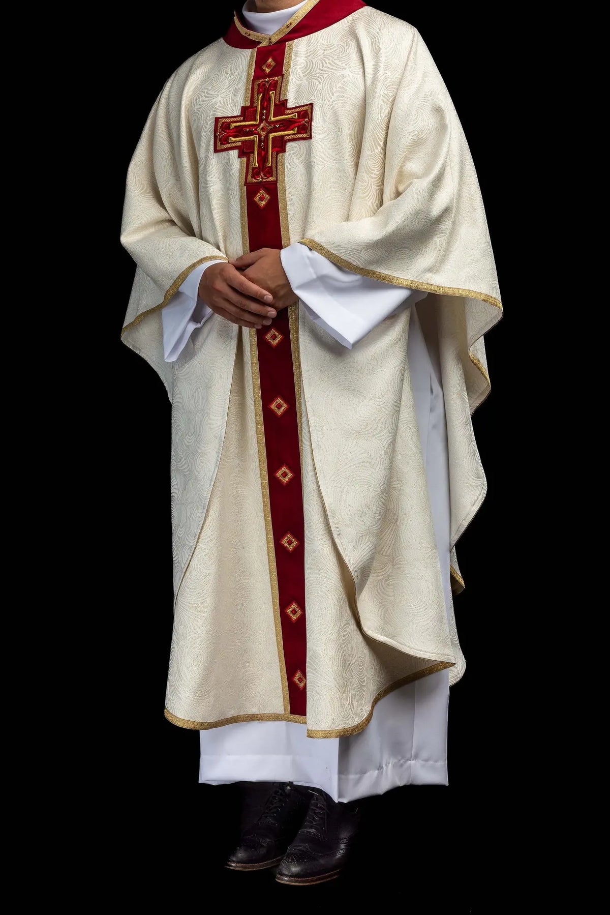 Ecru Easter chasuble with an embroidered cross, full worn front view