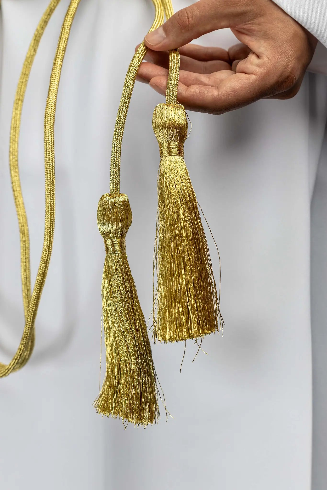 Gold liturgical cincture with decorative tassels made from braided cord