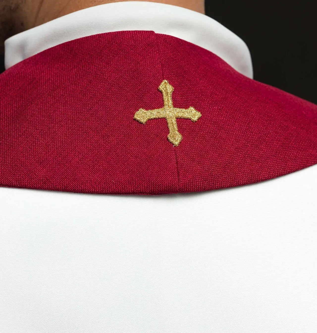 Red stole embroidered with the IHS motif
