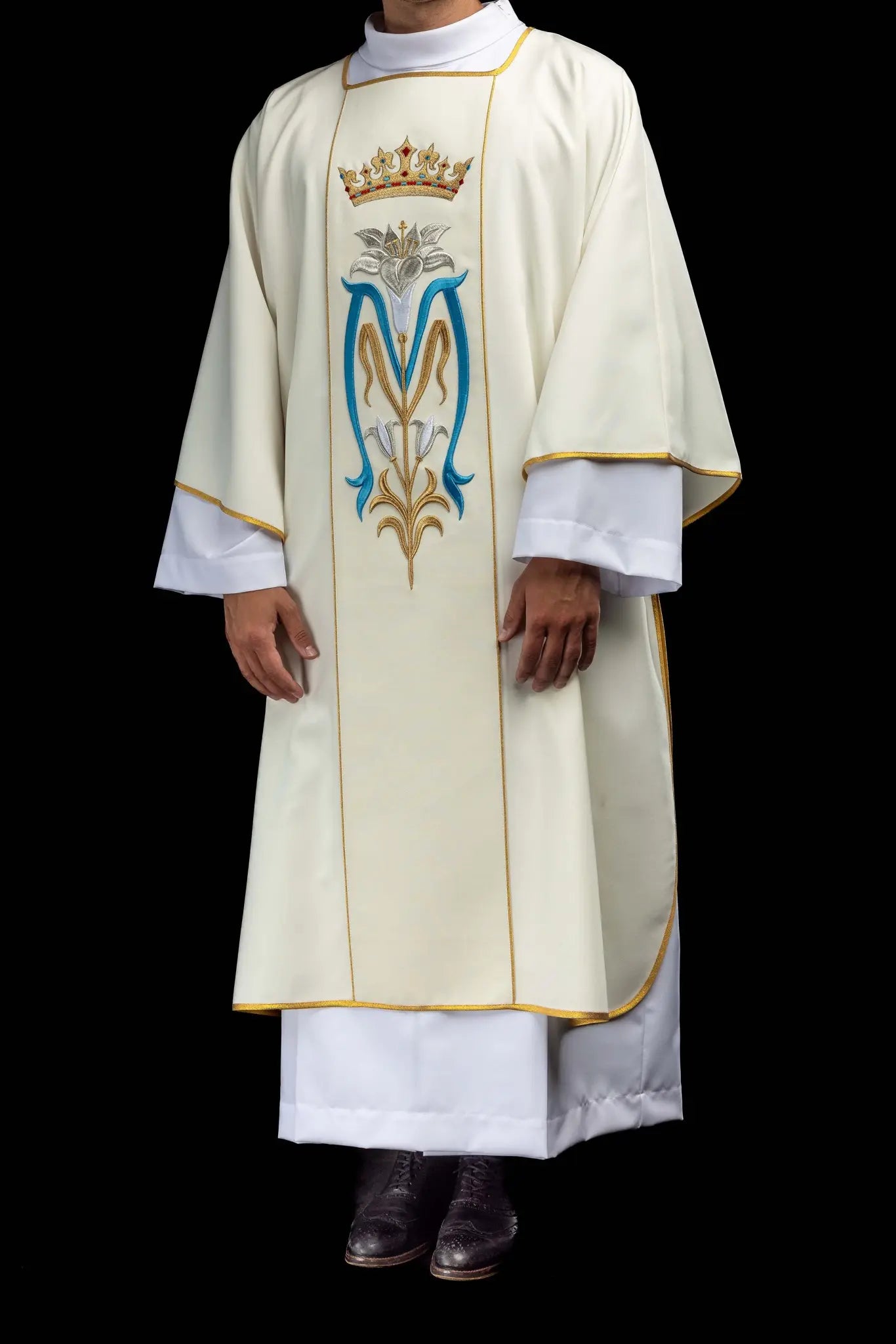 Ecru dalmatic with Marian embroidery, gold trim, and a matching stole.