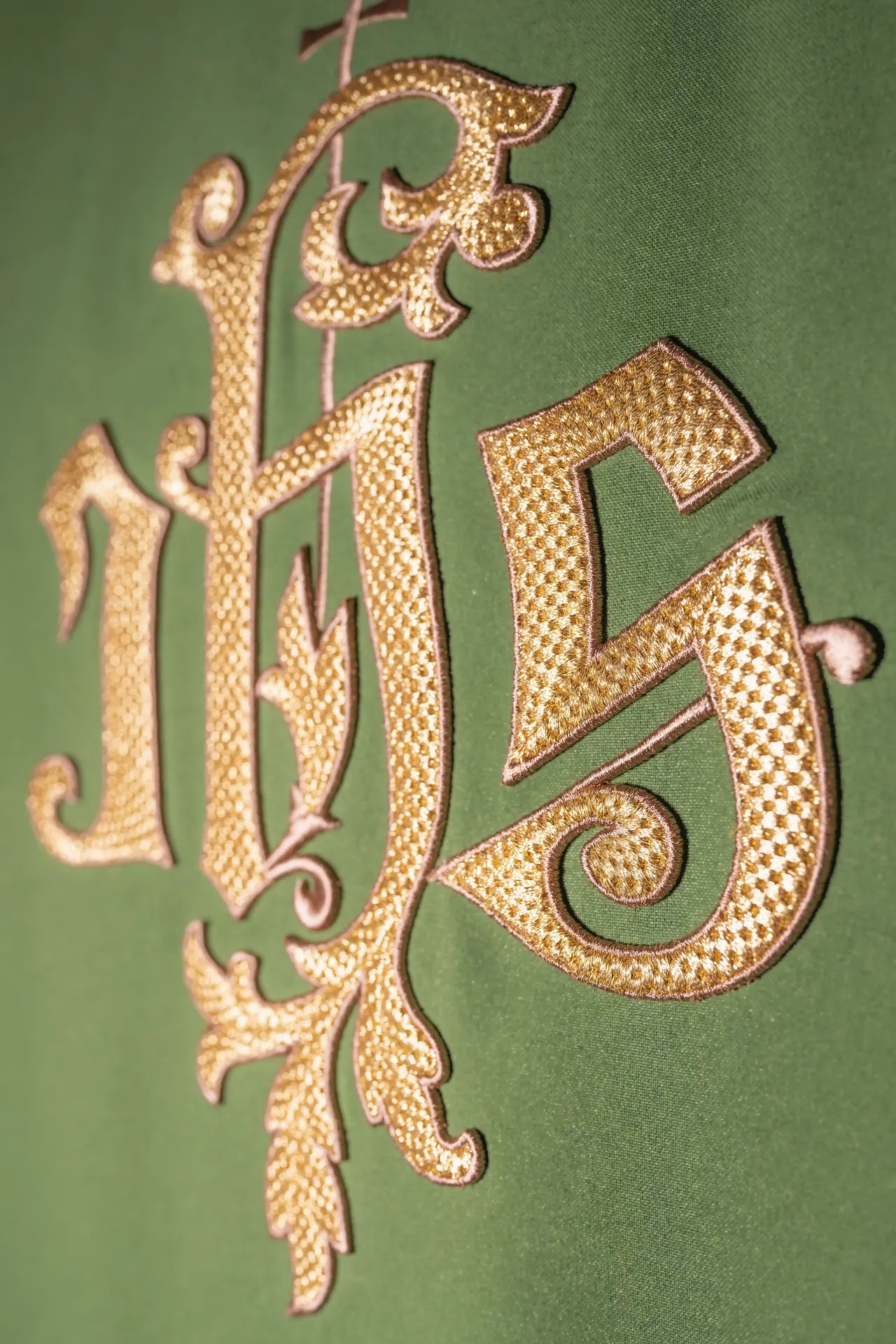 Green chasuble with gold IHS embroidery