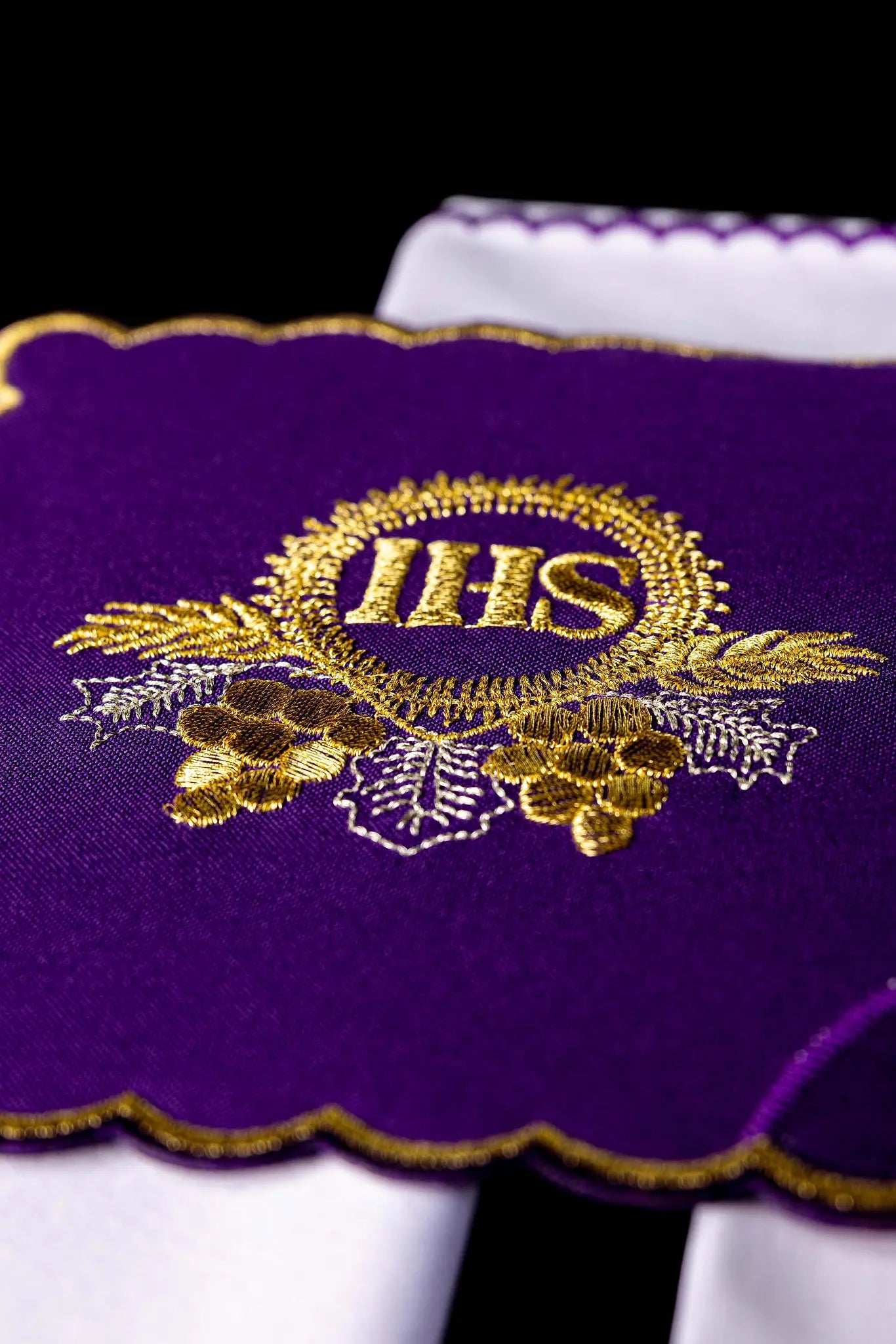 Purple chalice linen set with gold IHS embroidery on pall, corporal, purificator, and lavabo towel