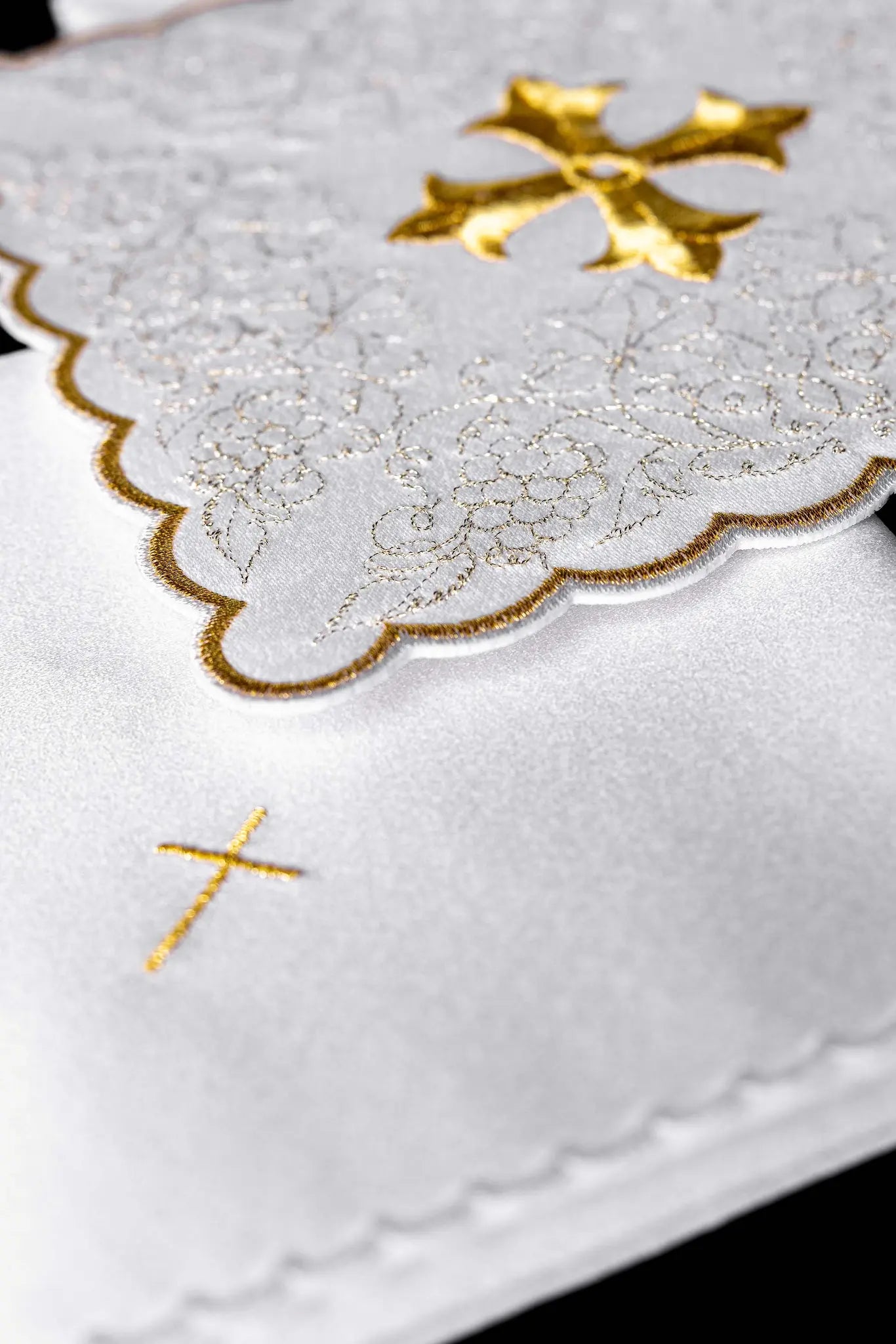White chalice linen set with gold embroidered cross motif, including pall, corporal, purificator, and lavabo towel.
