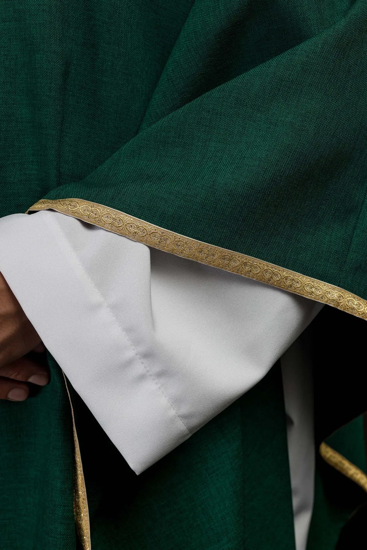 Green liturgical chasuble with a gold IHS embroidery