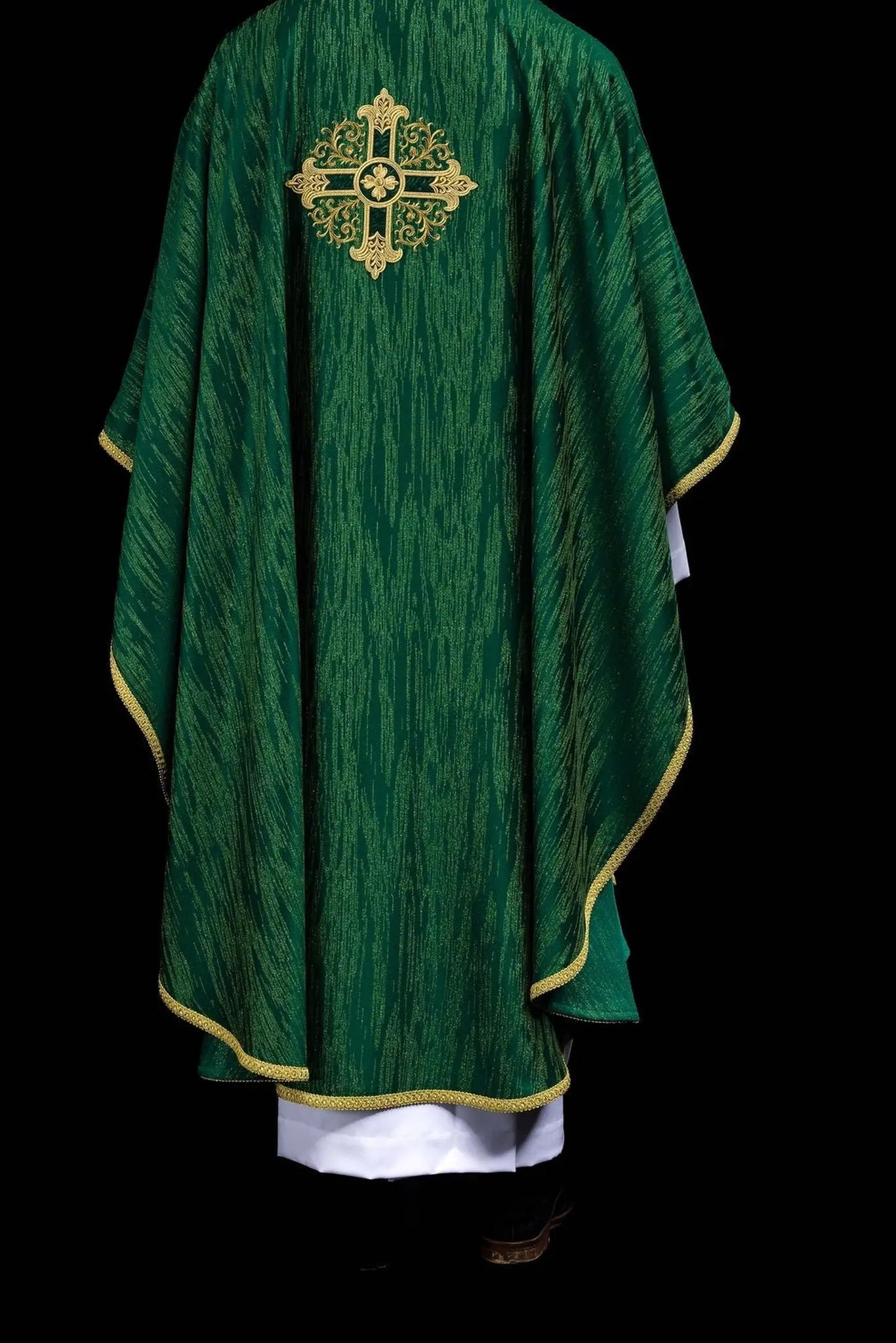 Green chasuble with an embroidered cross motif on decorative fabric