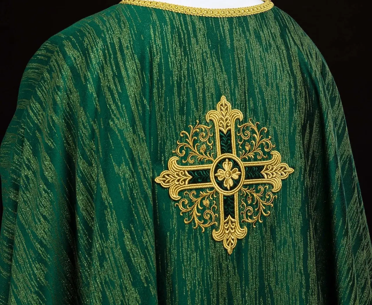 Green chasuble with an embroidered cross motif on decorative fabric