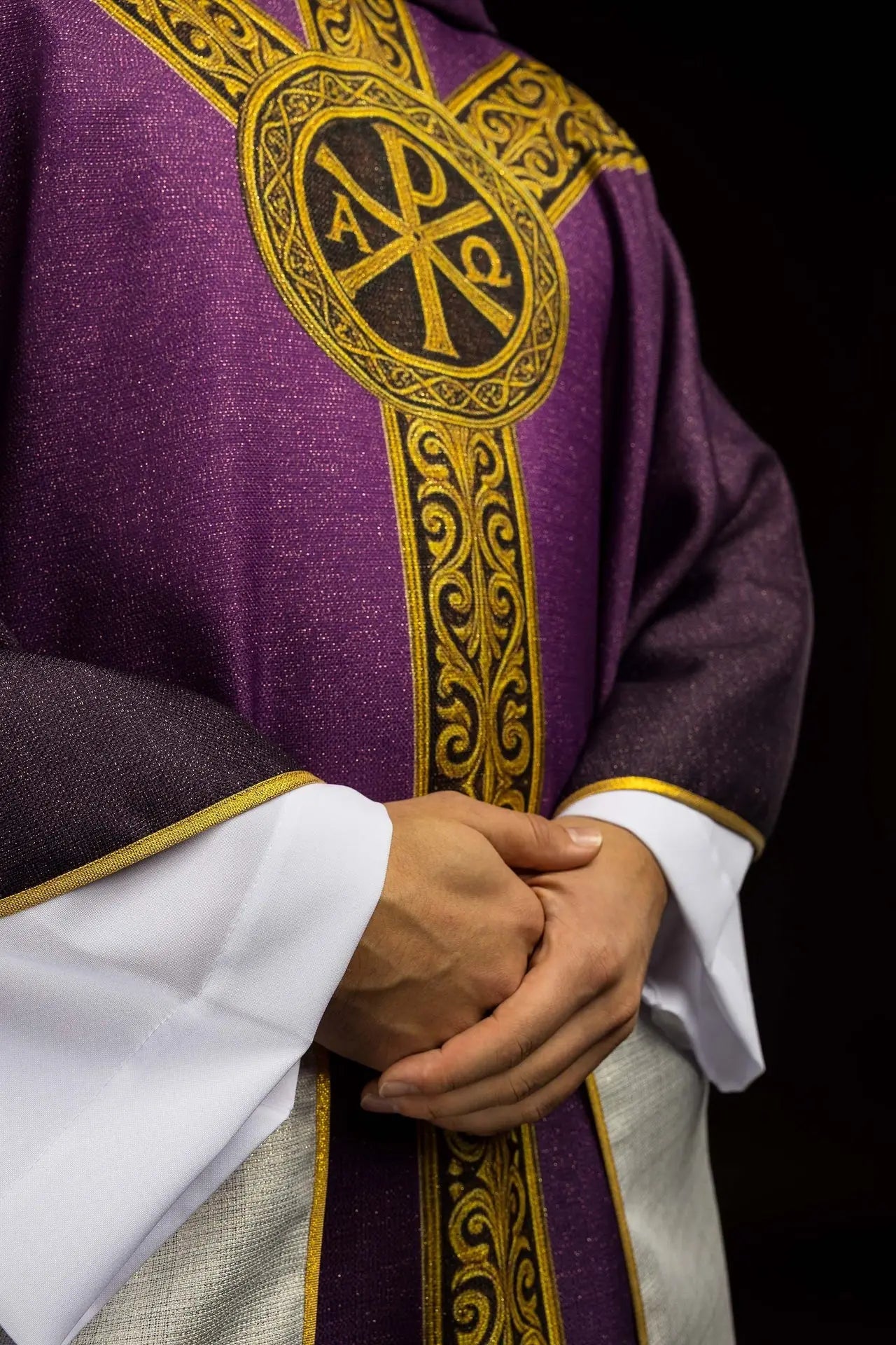 Purple printed “Pax” chasuble with rich gold decoration