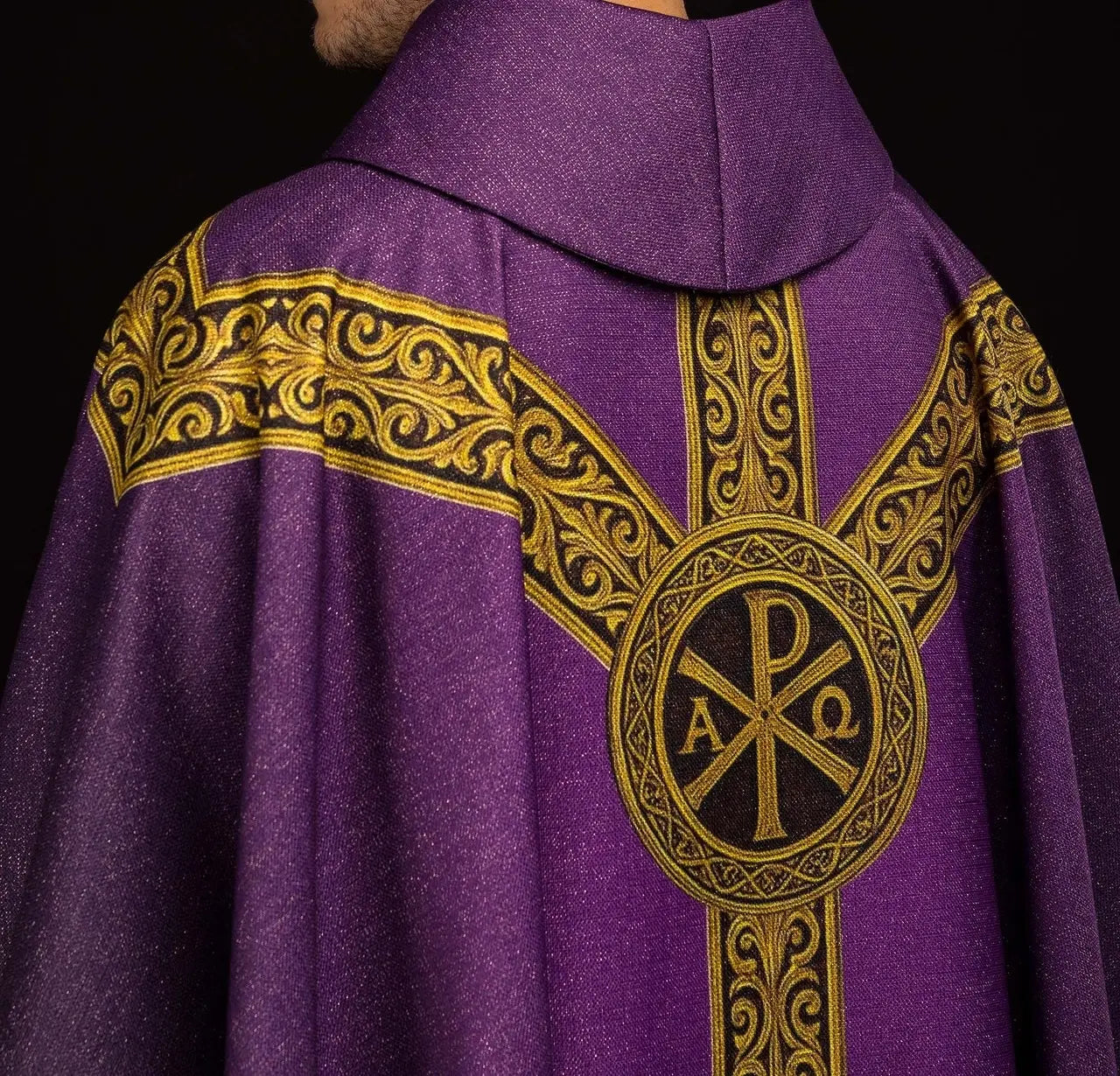 Purple printed “Pax” chasuble with rich gold decoration