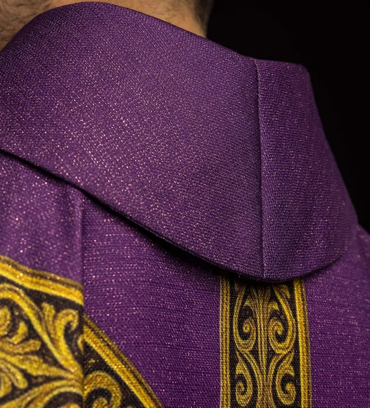 Purple printed “Pax” chasuble with rich gold decoration