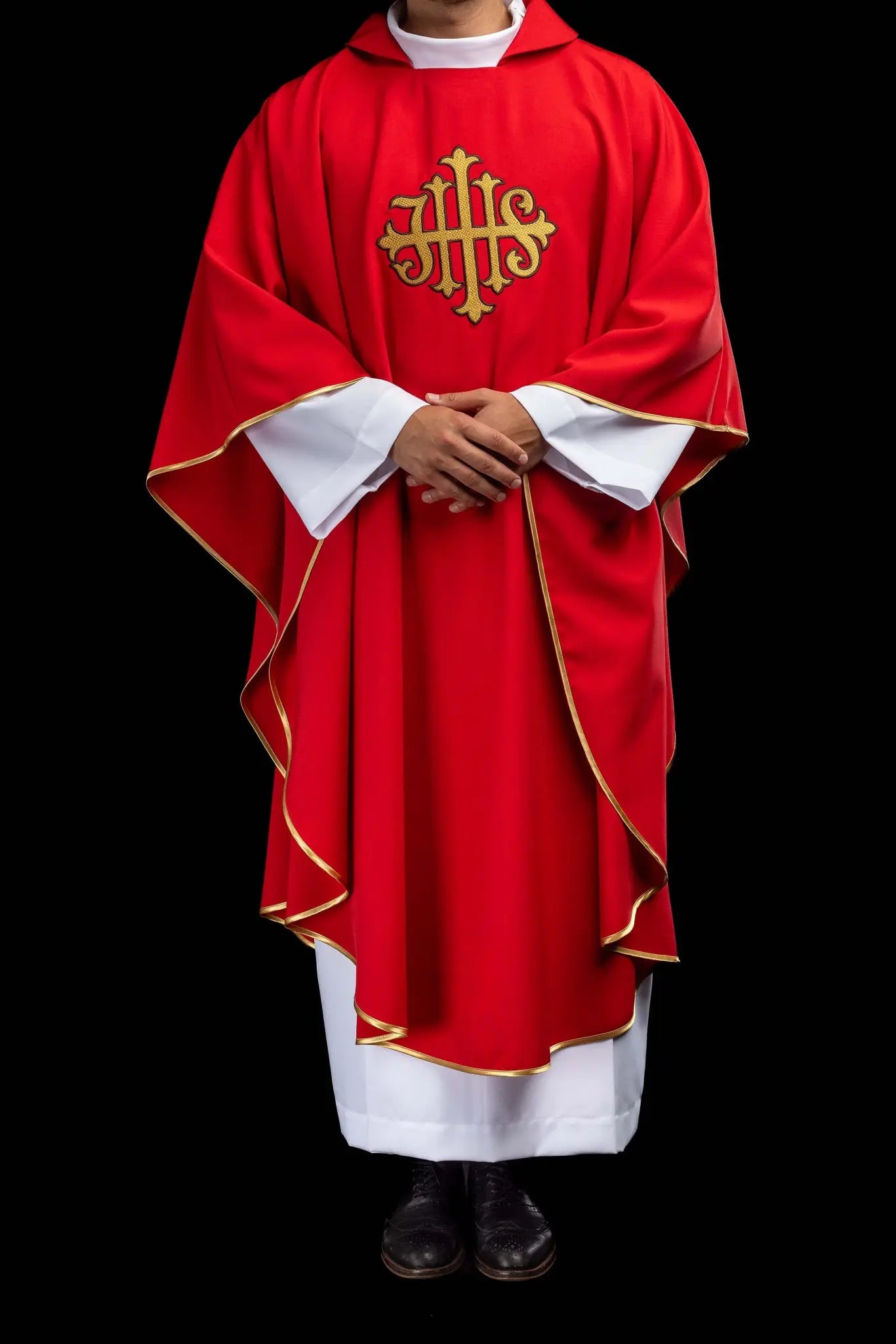 Red chasuble with gold IHS embroidery on the front and back, finished with gold trim and a V-neckline.