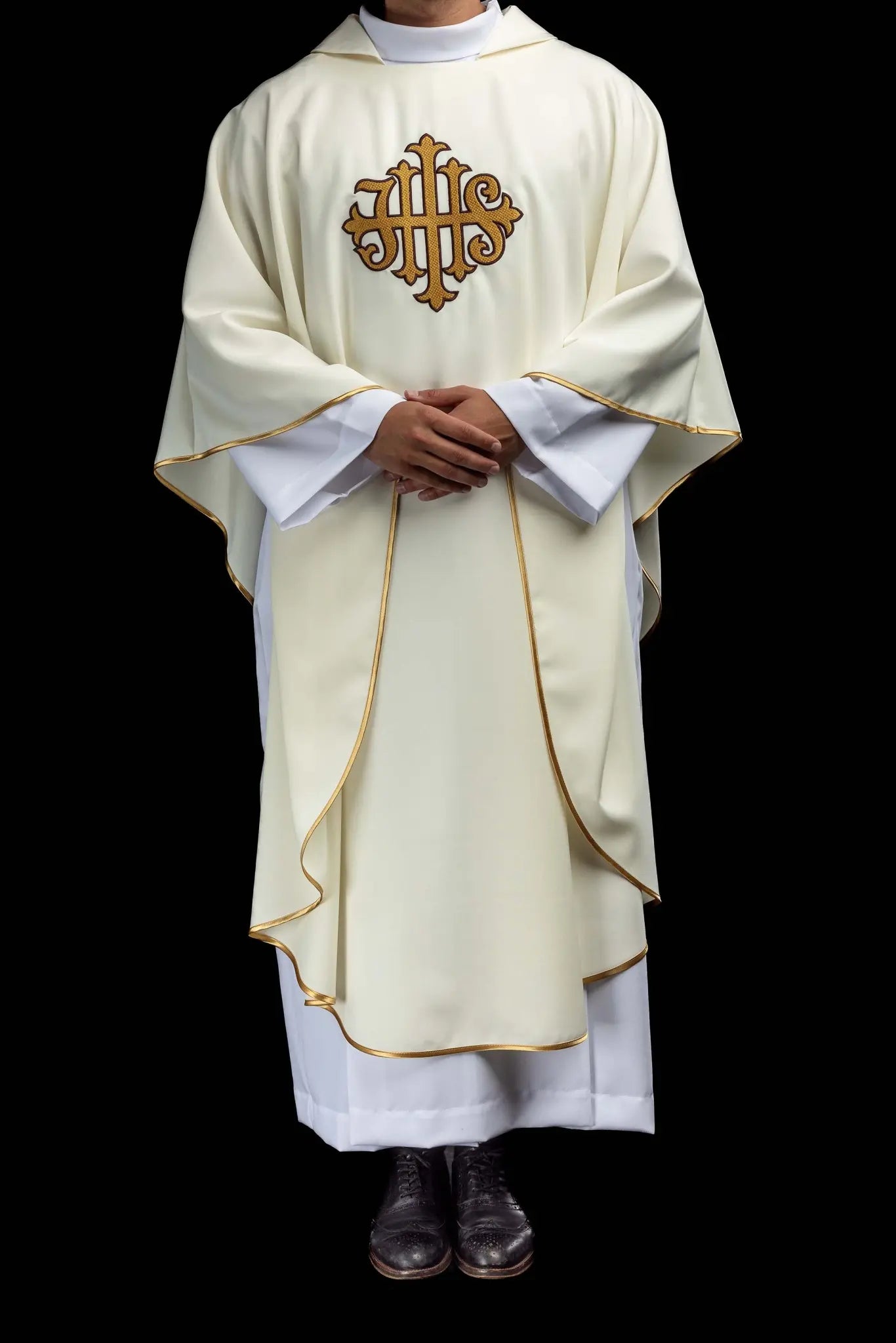 Ecru chasuble with gold IHS embroidery and gold trim, featuring a V-neck collar.
