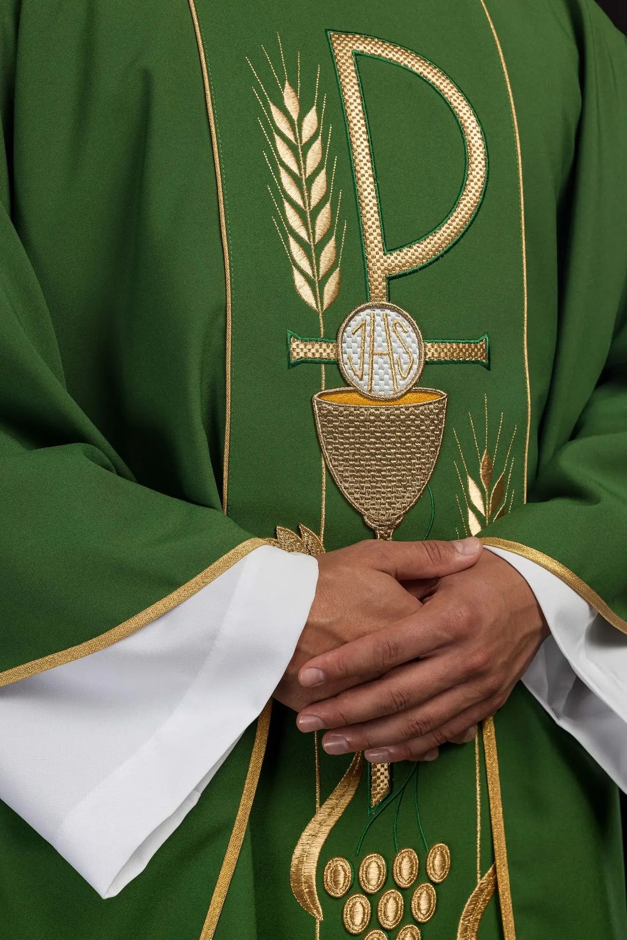 Green chasuble embroidered with IHS chalice design