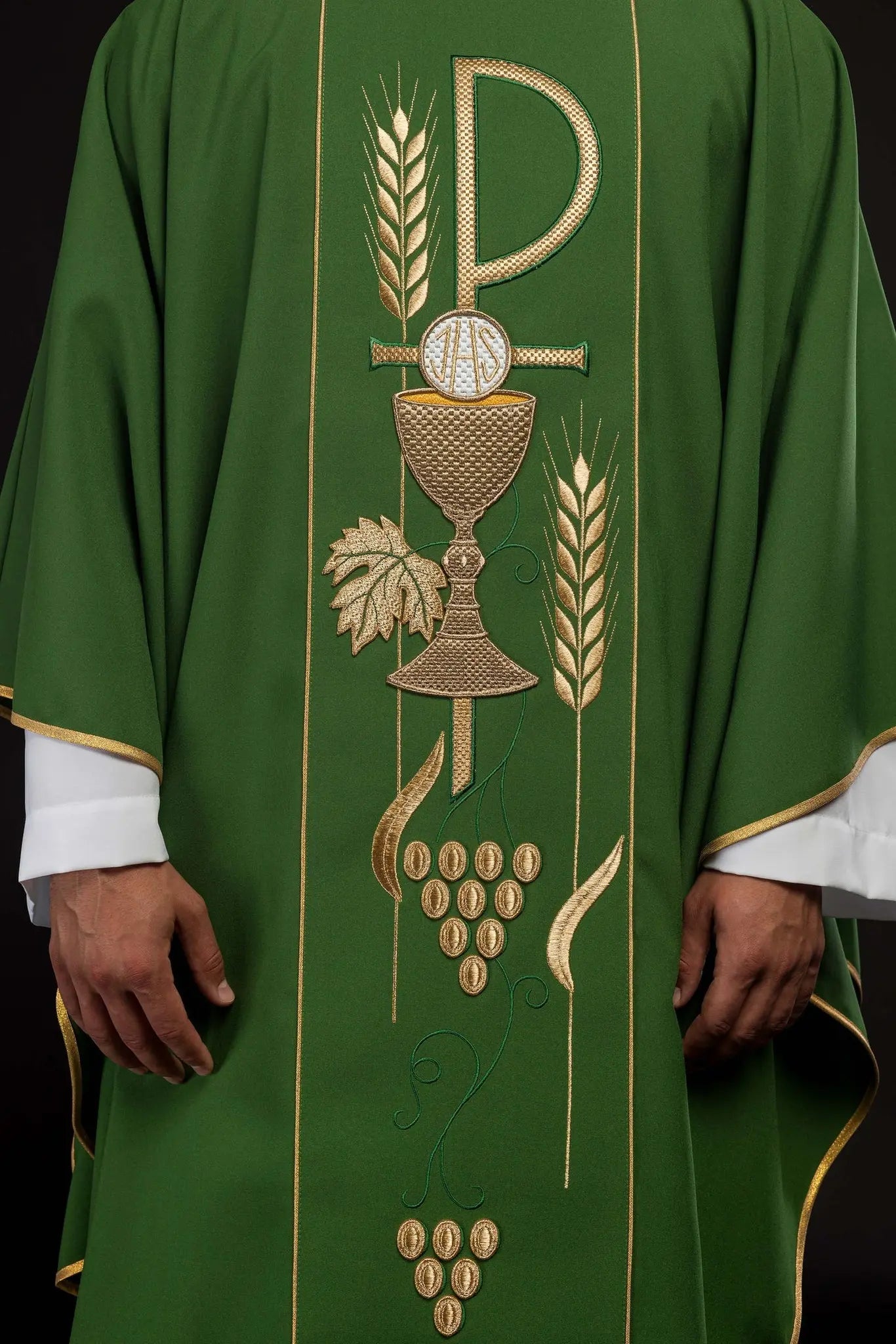 Green chasuble embroidered with IHS chalice design