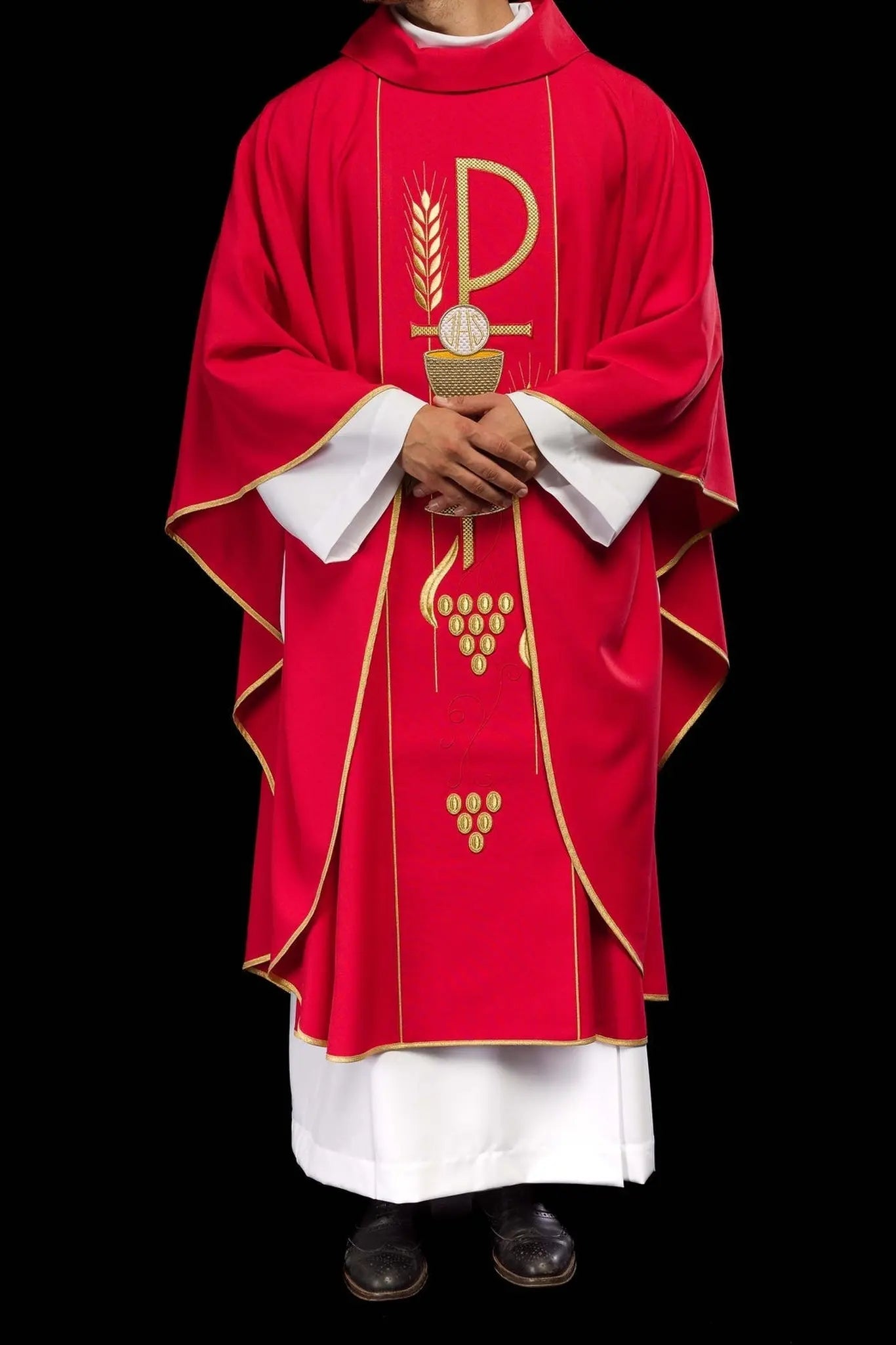 Red chasuble embroidered with IHS chalice design