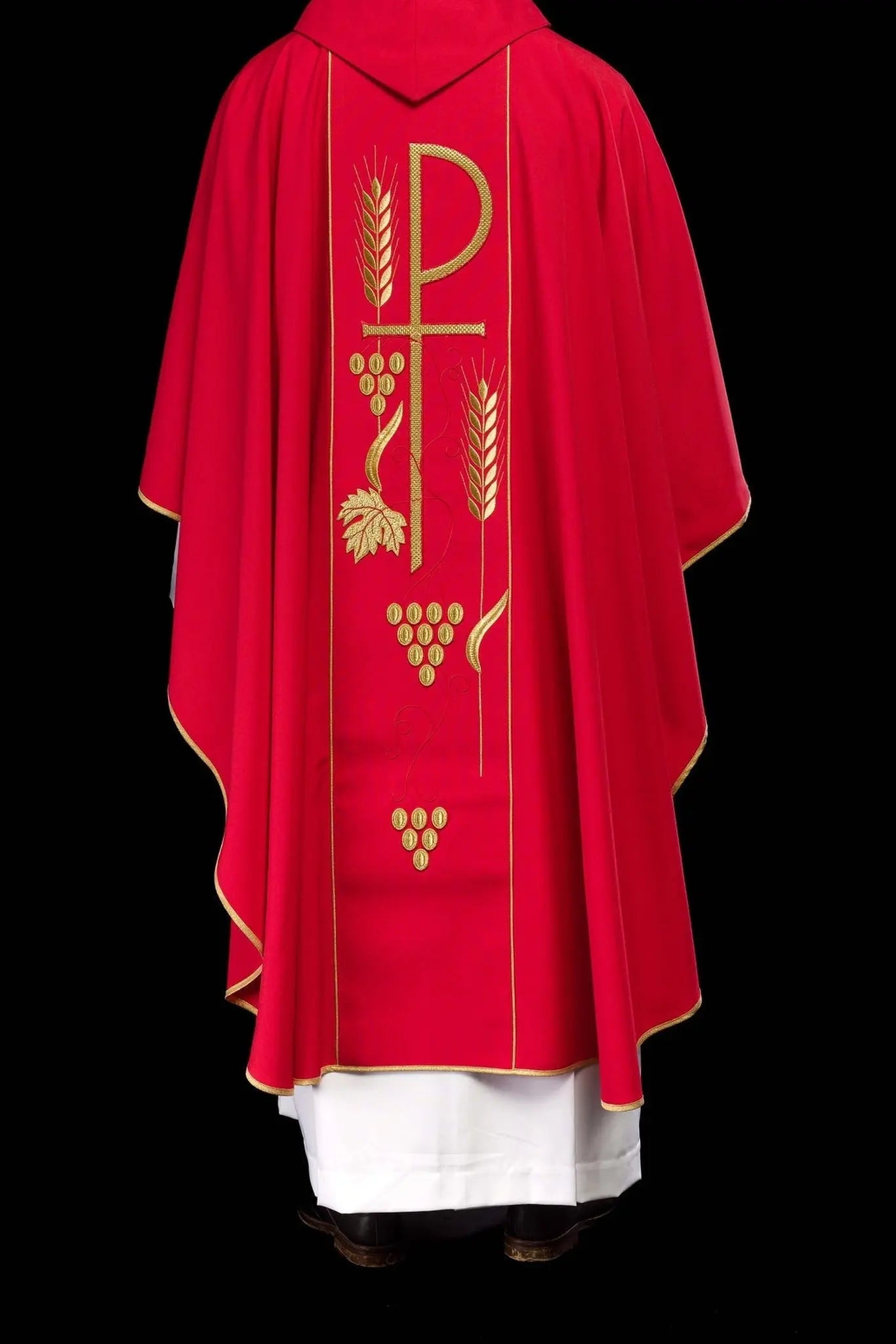 Red chasuble embroidered with IHS chalice design