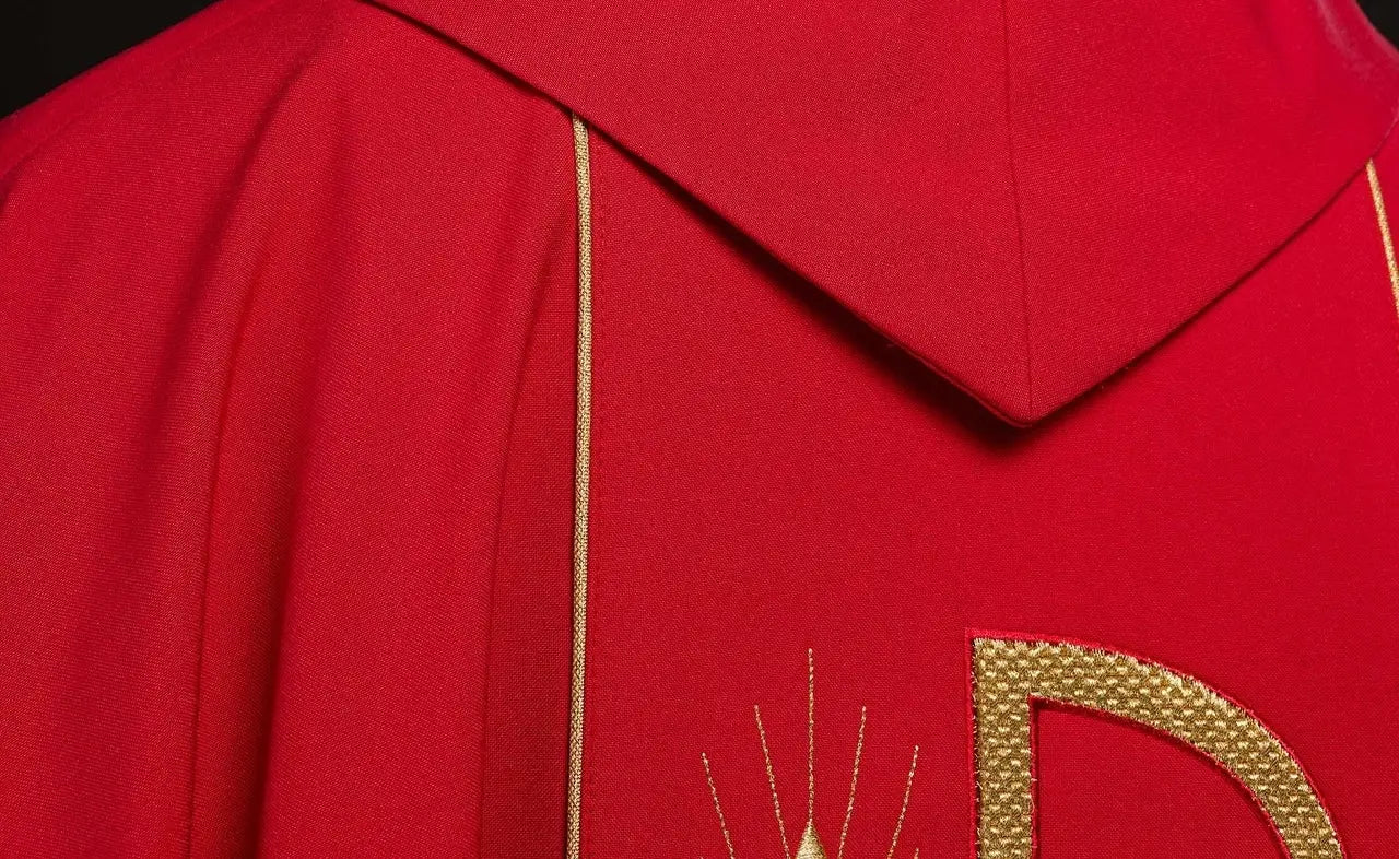 Red chasuble embroidered with IHS chalice design