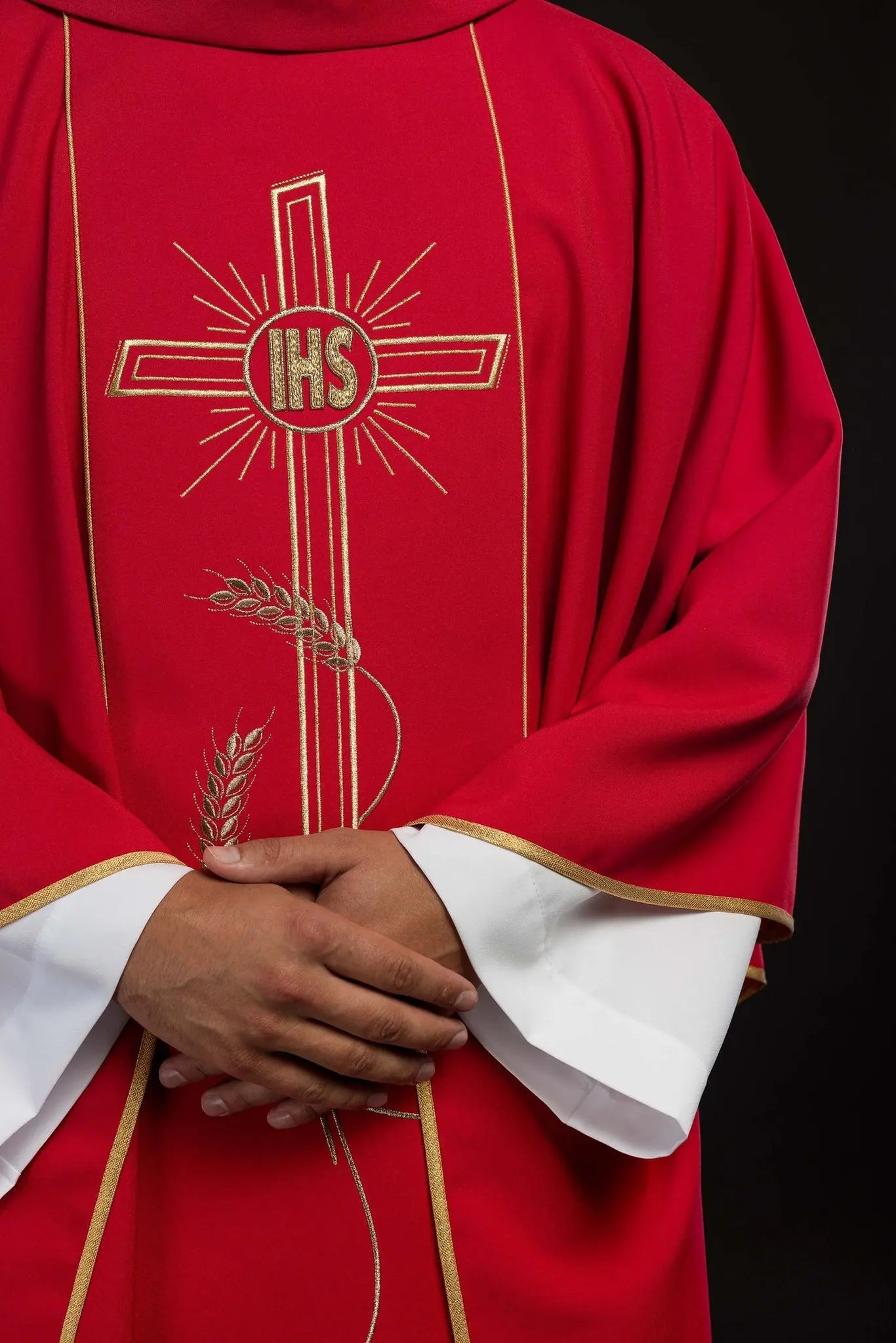 Red chasuble with wide embroidered gold stripe IHS cross