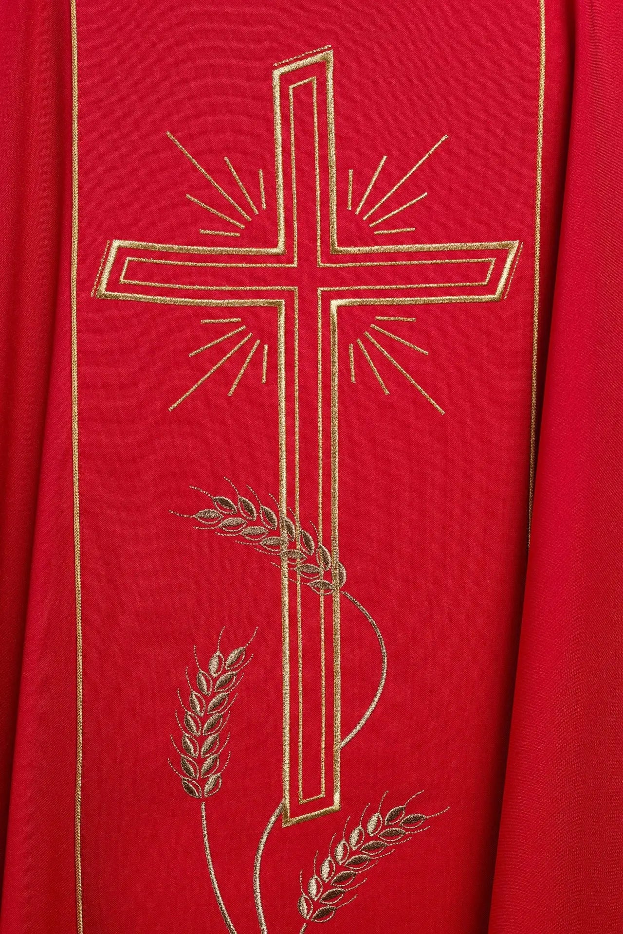 Red chasuble with wide embroidered gold stripe IHS cross
