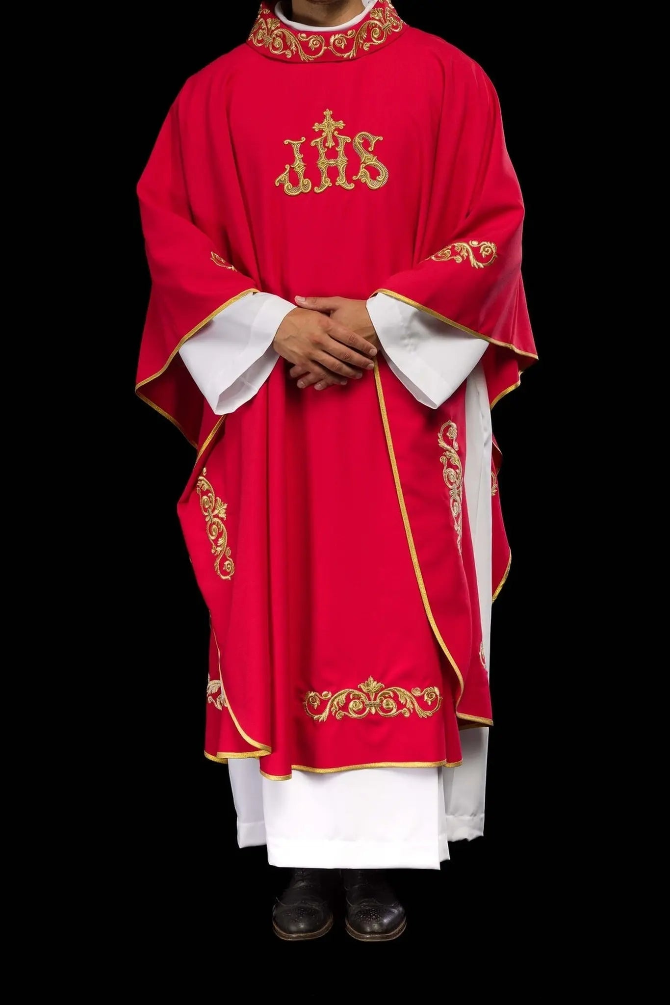 Red chasuble with gold IHS embroidery and decorative trim