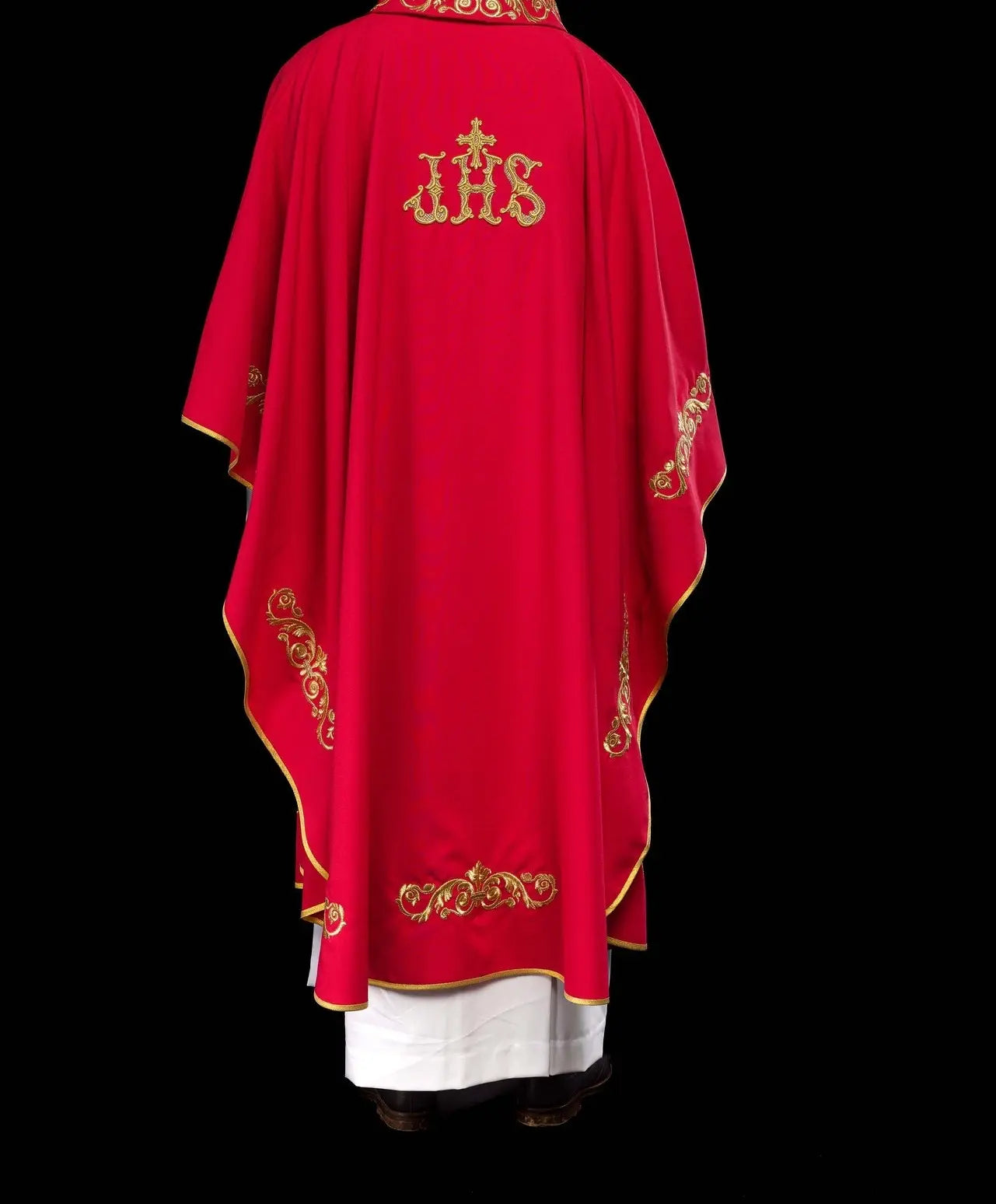 Red chasuble with gold IHS embroidery and decorative trim