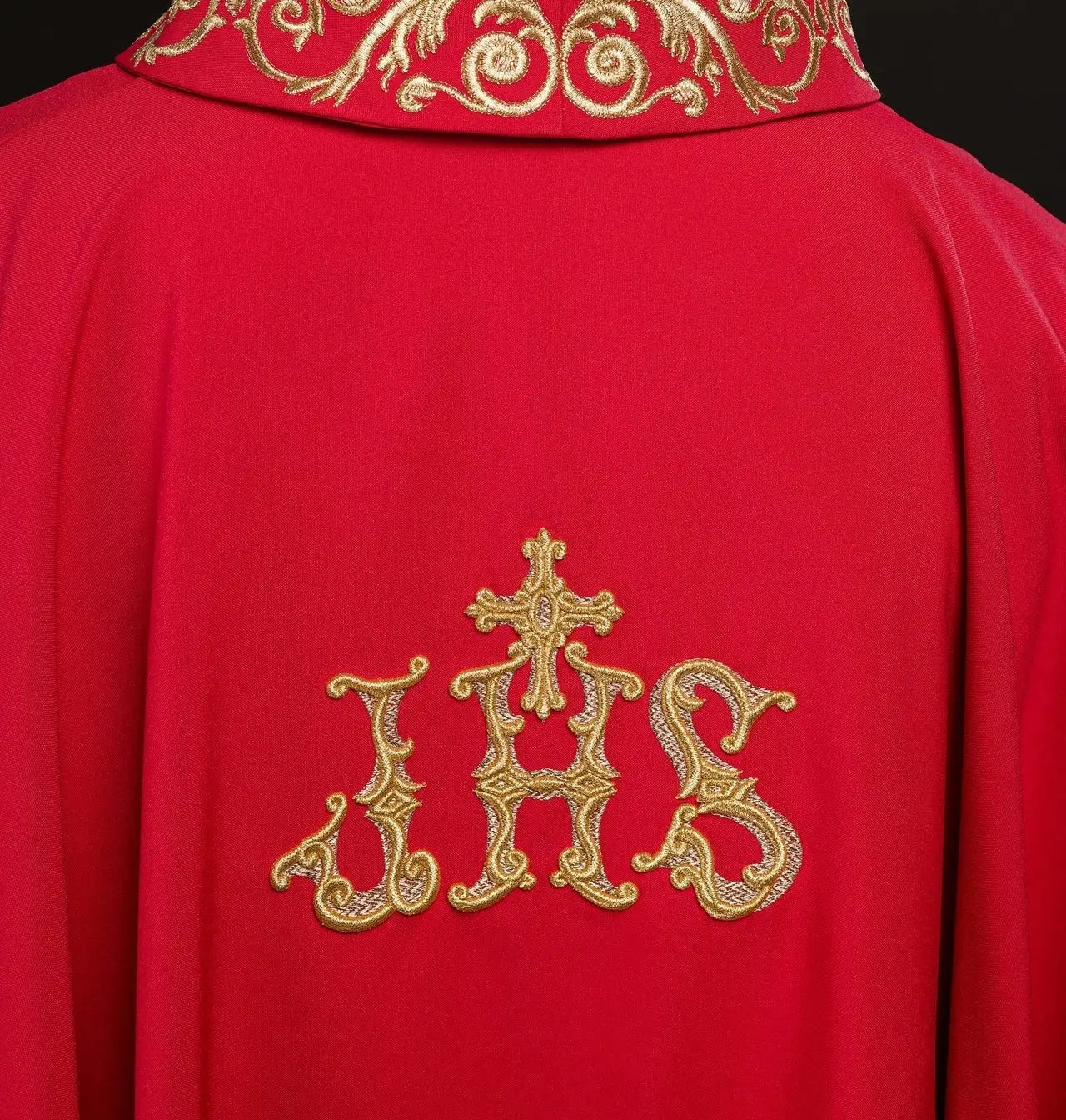 Red chasuble with gold IHS embroidery and decorative trim