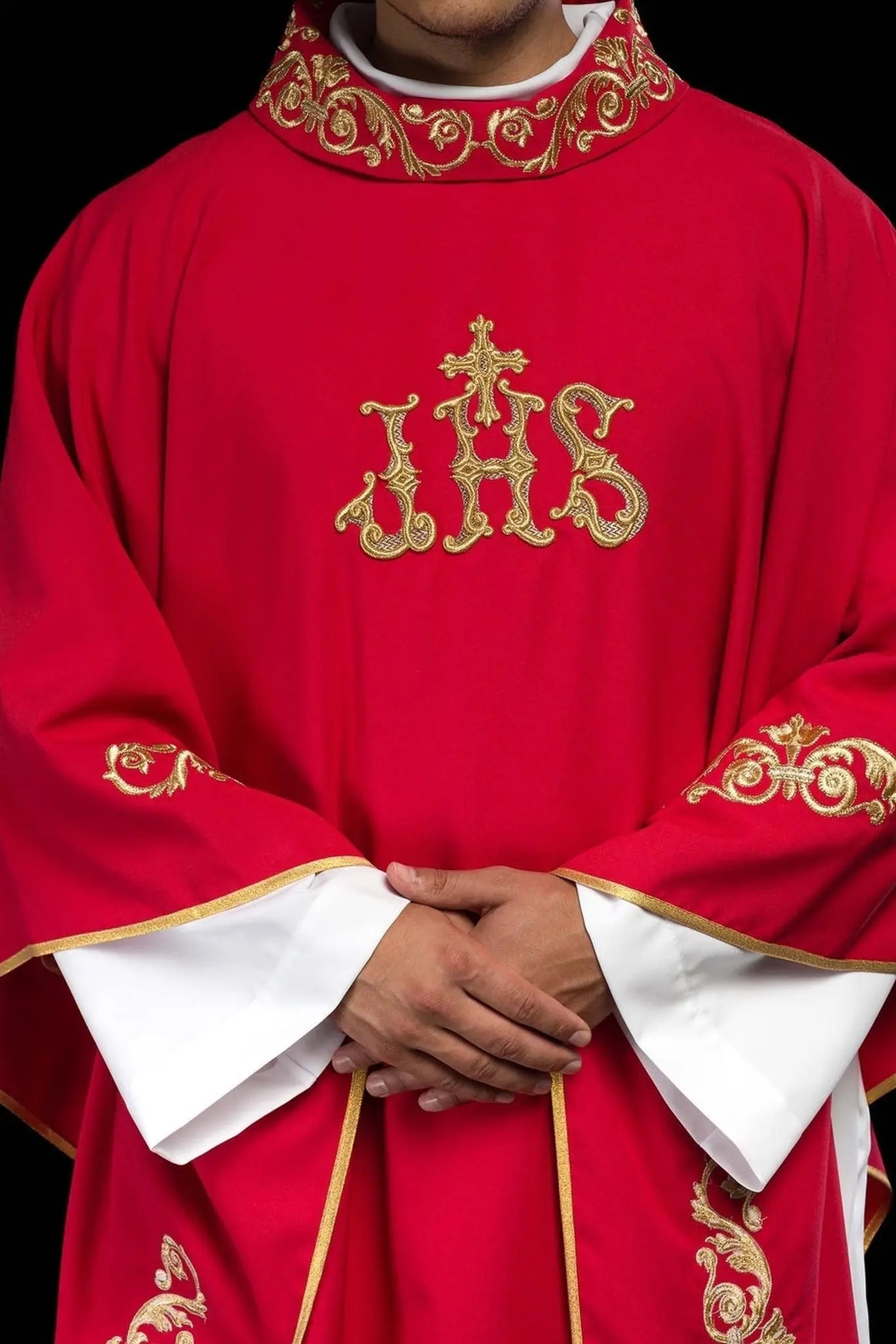 Red chasuble with gold IHS embroidery and decorative trim