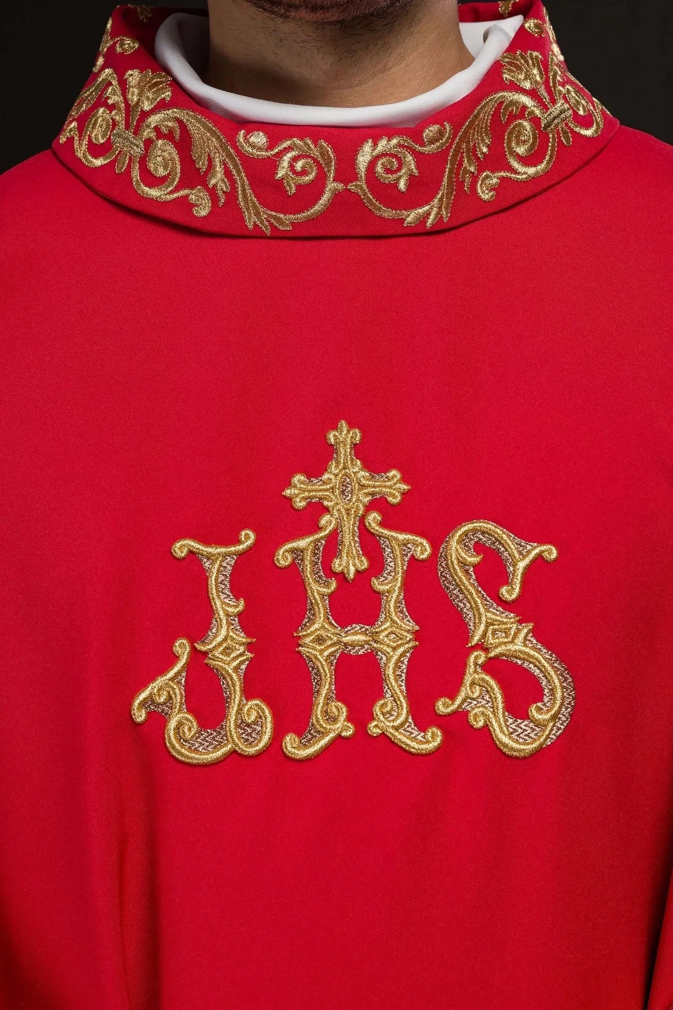 Red chasuble with gold IHS embroidery and decorative trim