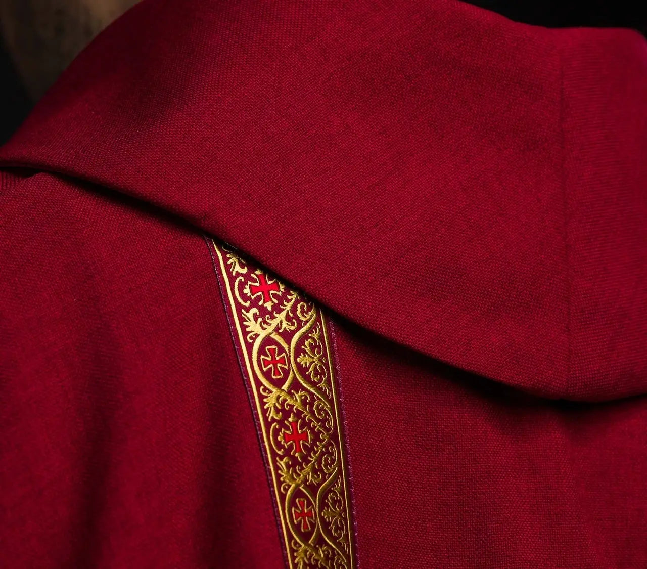 Red liturgical chasuble with embroidered cross and jacquard bands