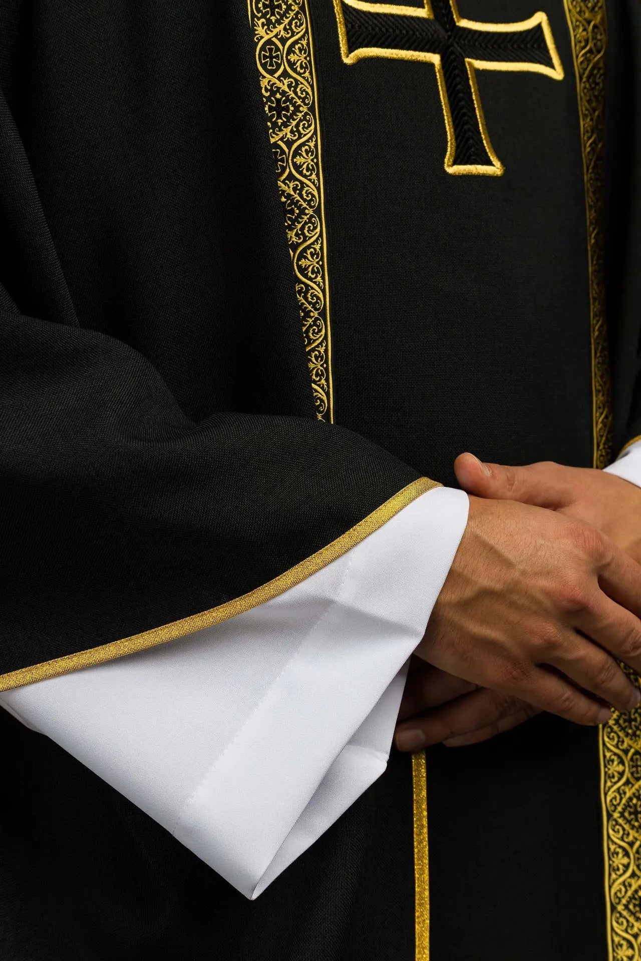 Black liturgical chasuble with embroidered cross and jacquard bands