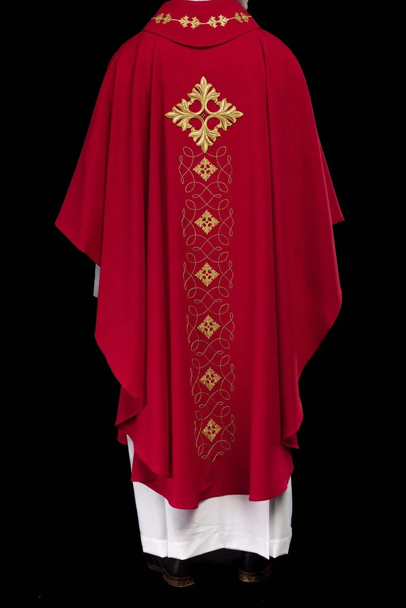 Red chasuble richly embroidered with rope and stones