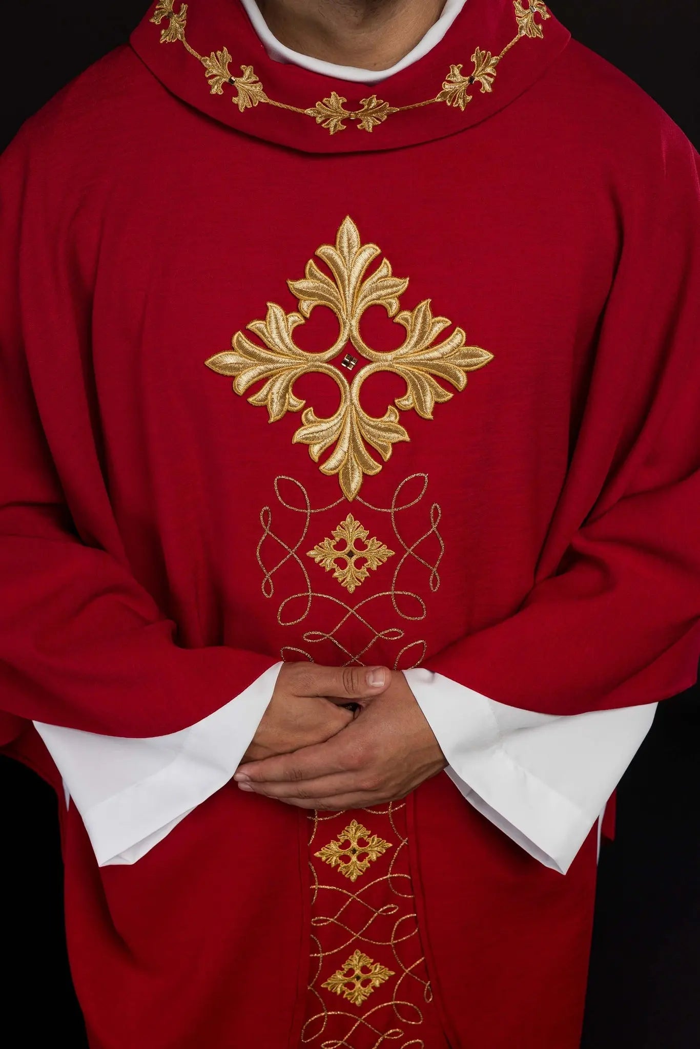Red chasuble richly embroidered with rope and stones