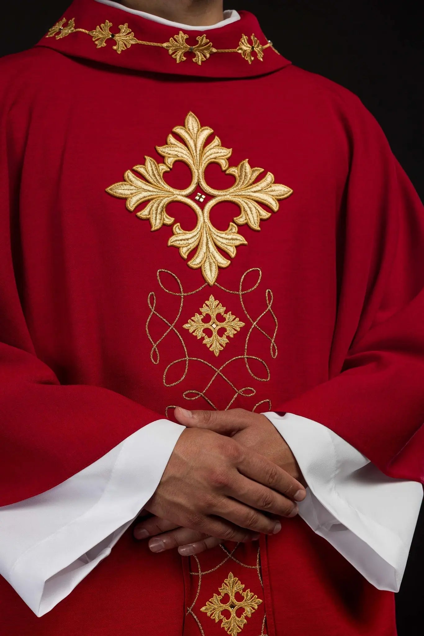 Red chasuble richly embroidered with rope and stones