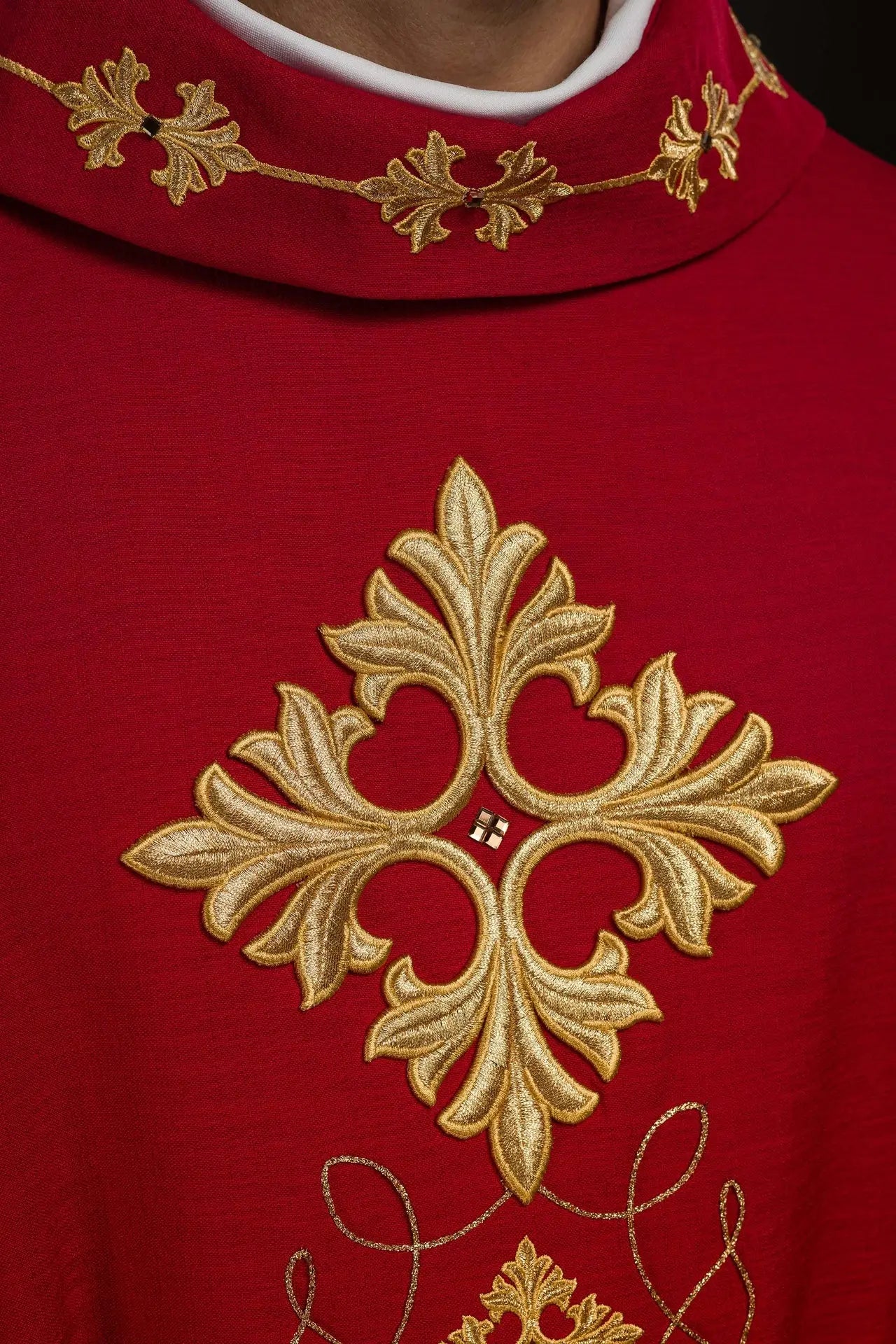 Red chasuble richly embroidered with rope and stones