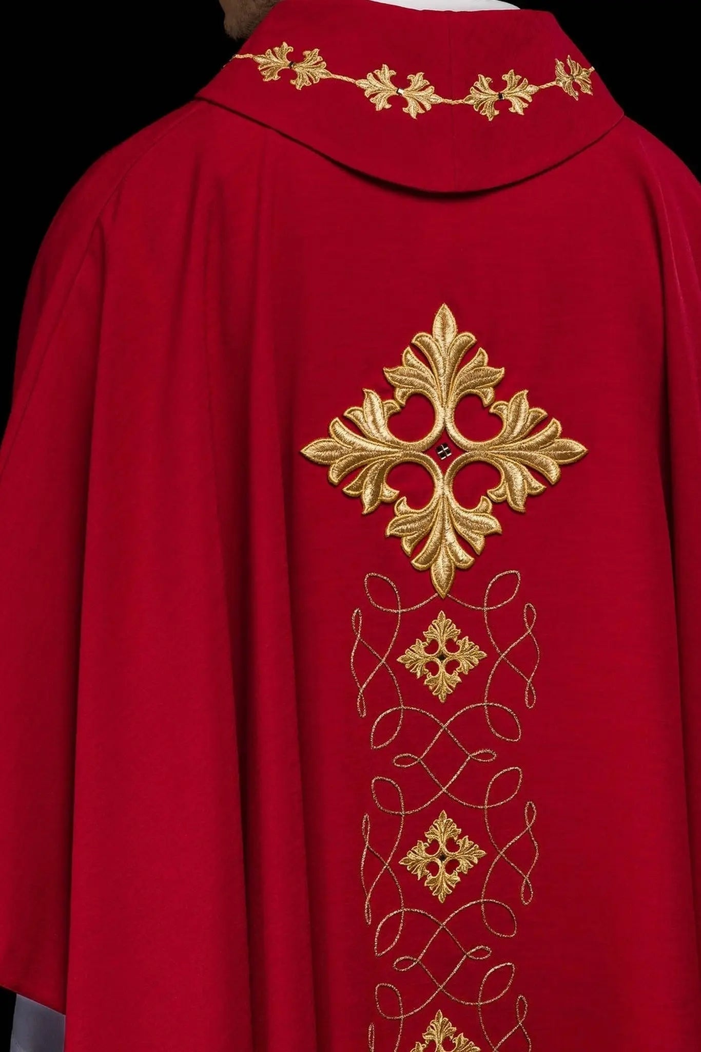Red chasuble richly embroidered with rope and stones