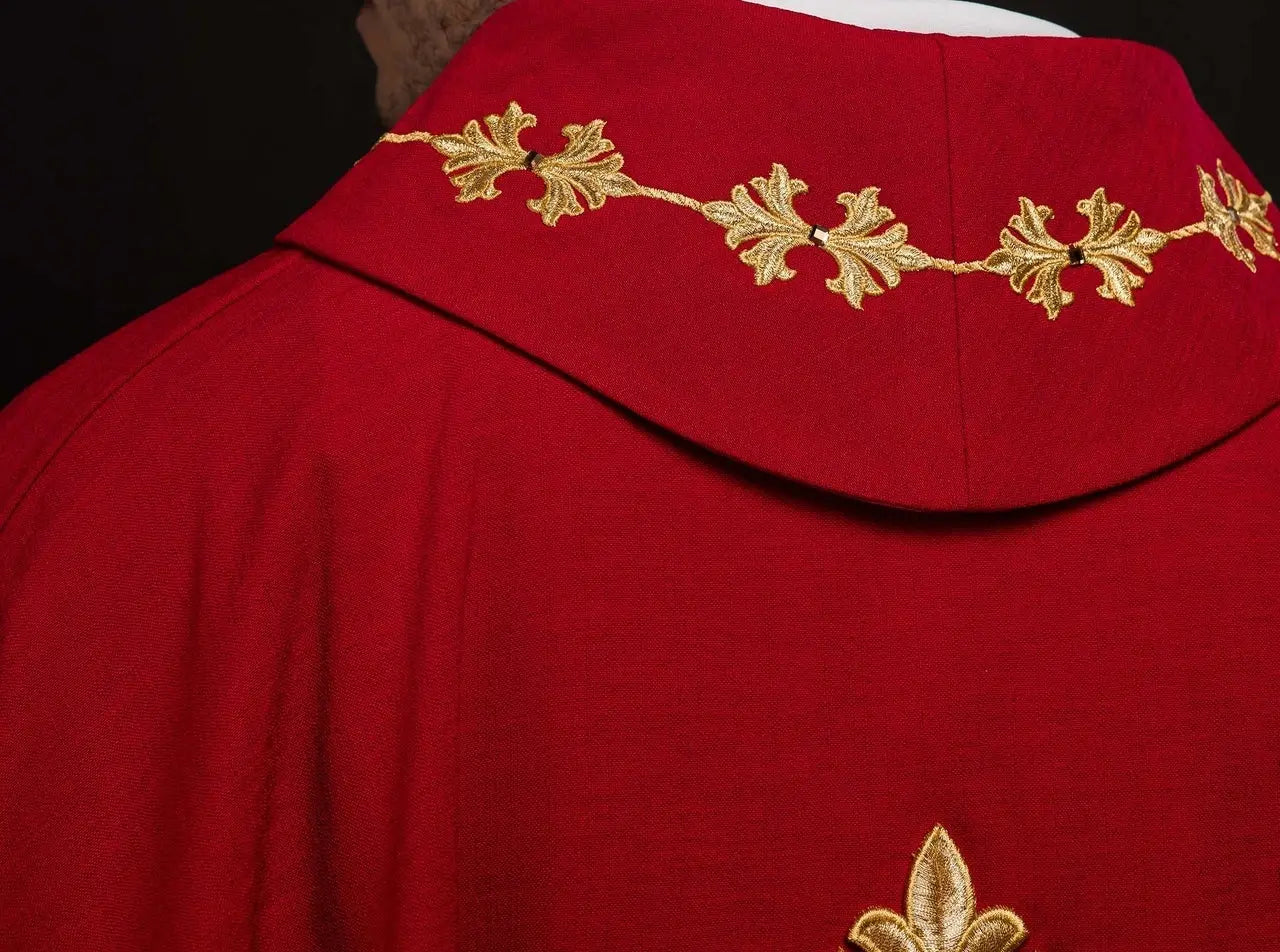 Red chasuble richly embroidered with rope and stones