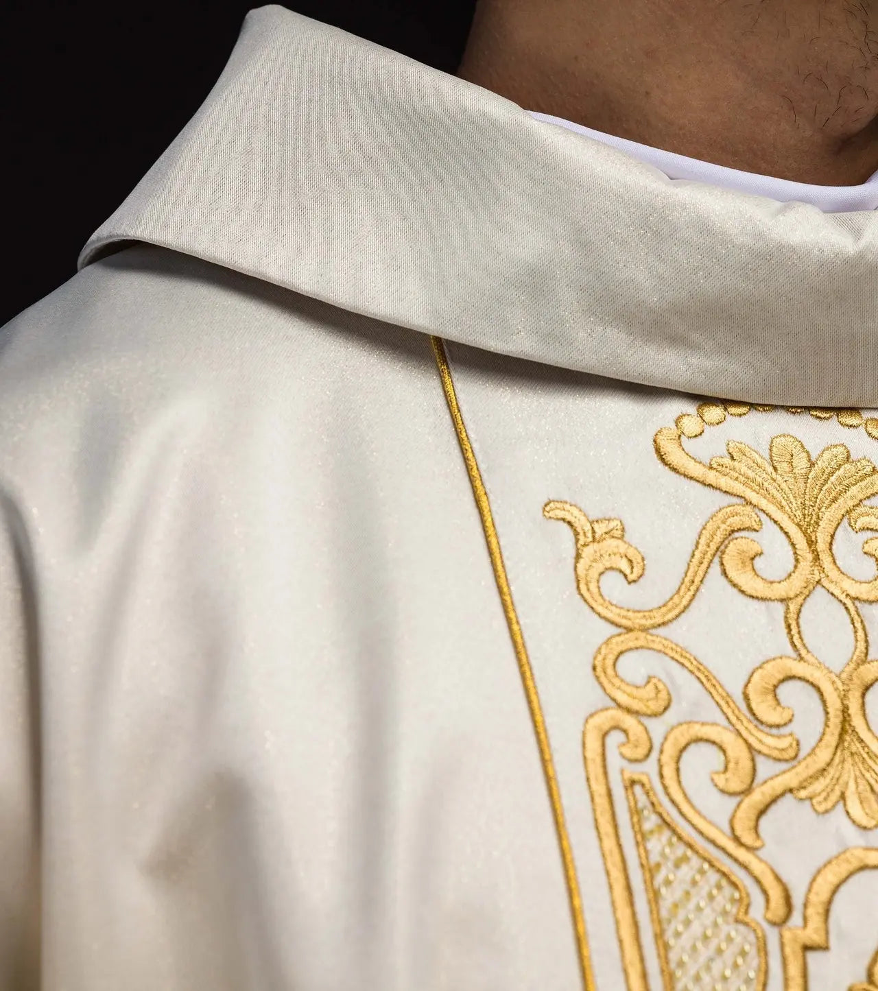 Shimmering fabric chasuble with rich gold embroidery on the belt
