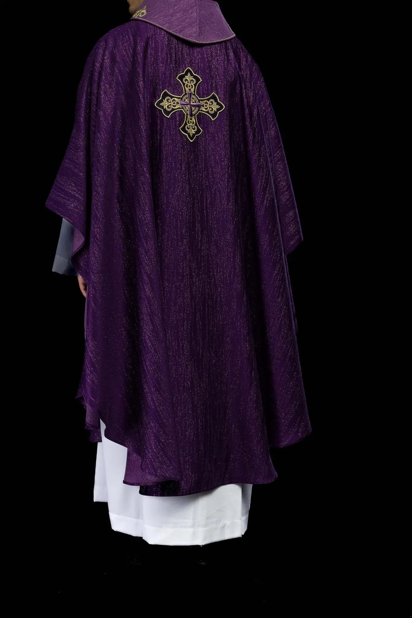 Purple chasuble with embroidered cross motif on de