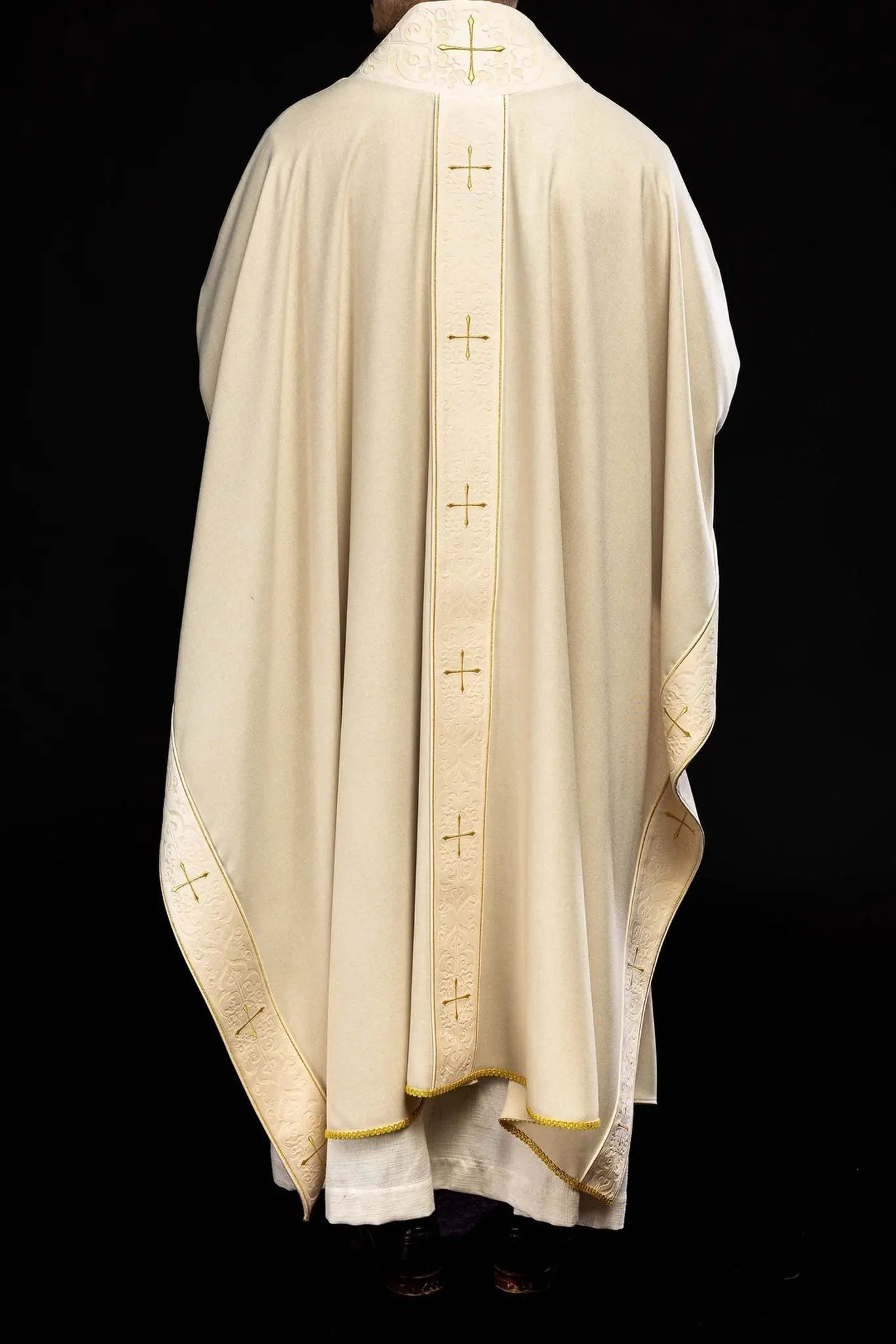 Chasuble in ecru color with an embroidered band and collar decorated with crosses