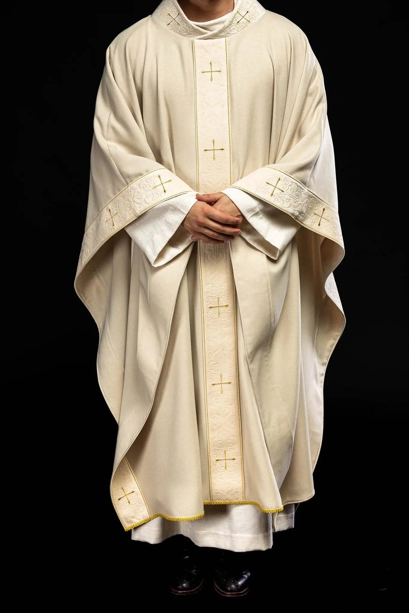 Chasuble in ecru color with an embroidered band and collar decorated with crosses
