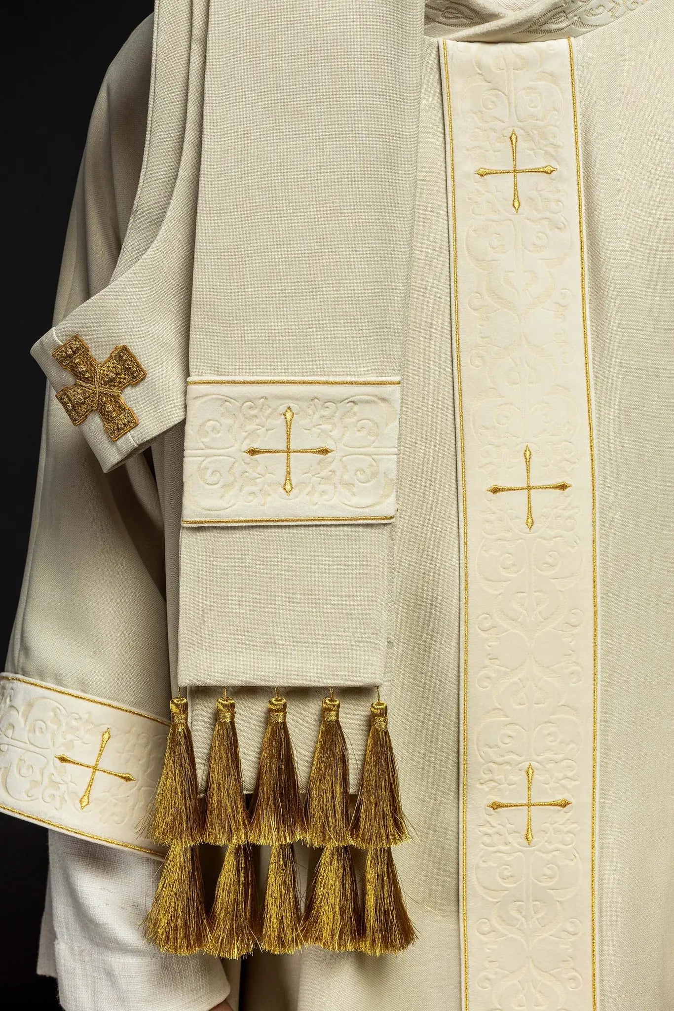 Chasuble in ecru color with an embroidered band and collar decorated with crosses