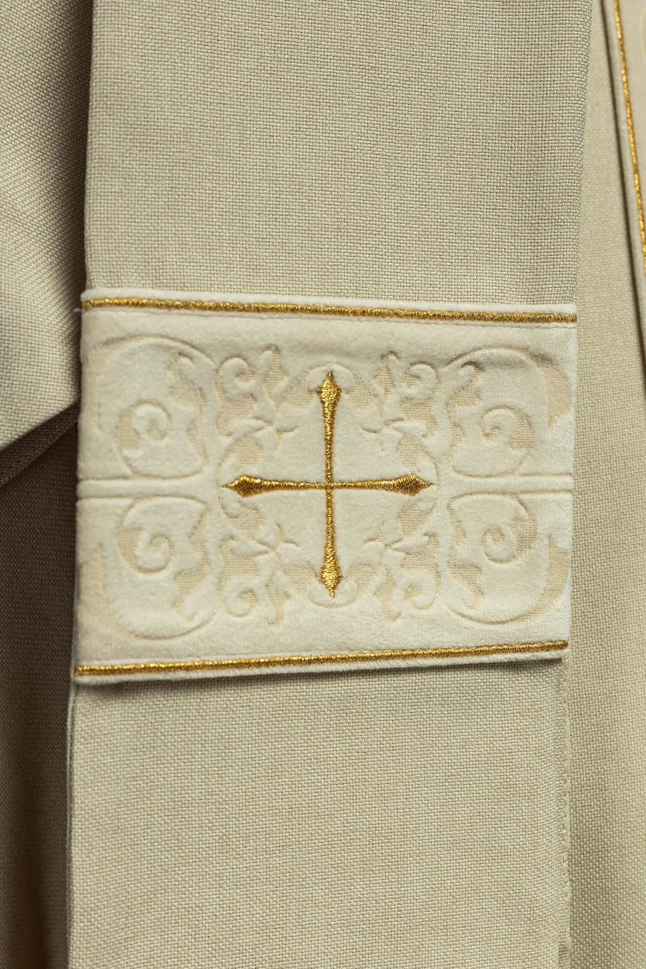 Chasuble in ecru color with an embroidered band and collar decorated with crosses