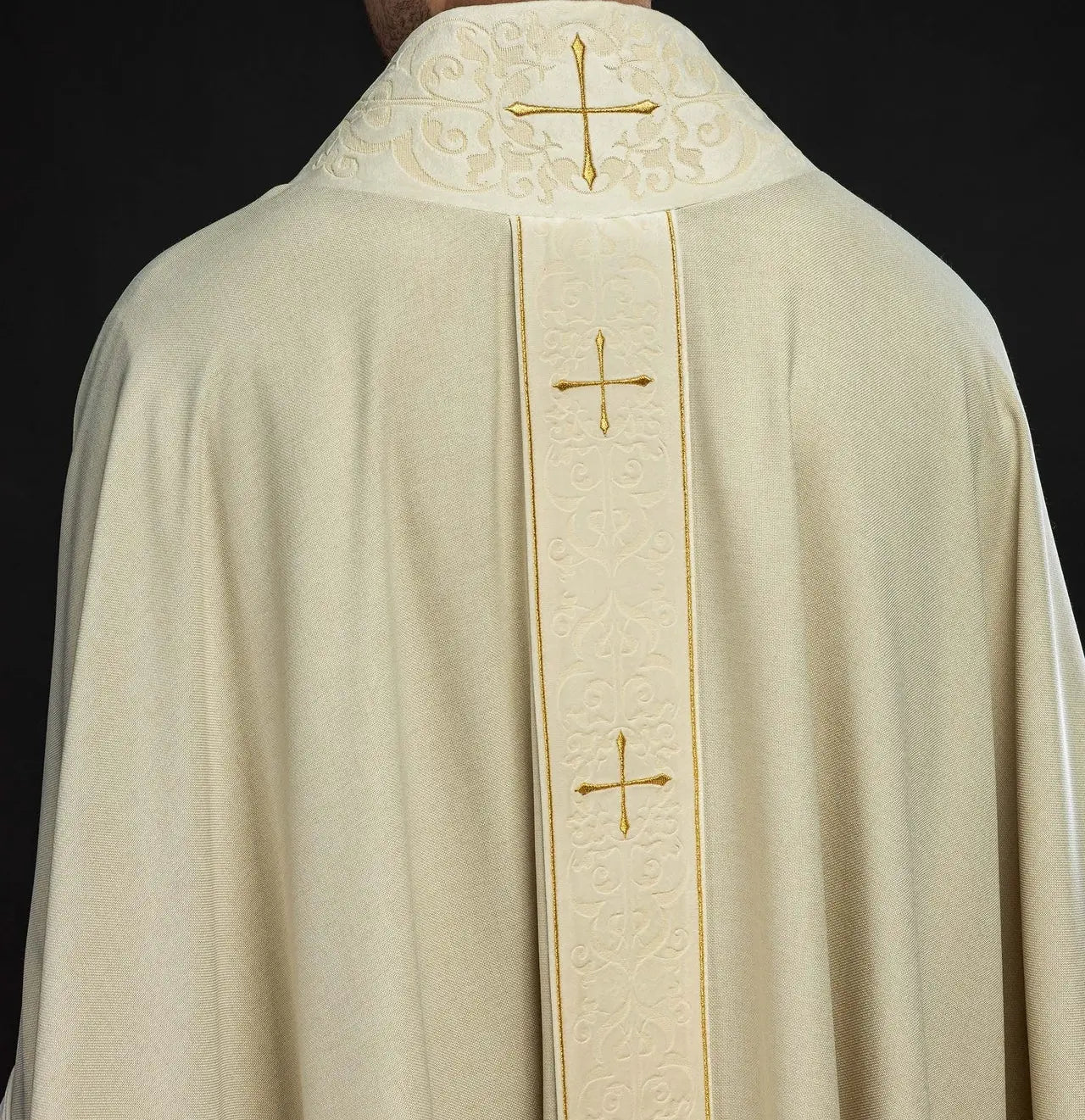 Chasuble in ecru color with an embroidered band and collar decorated with crosses