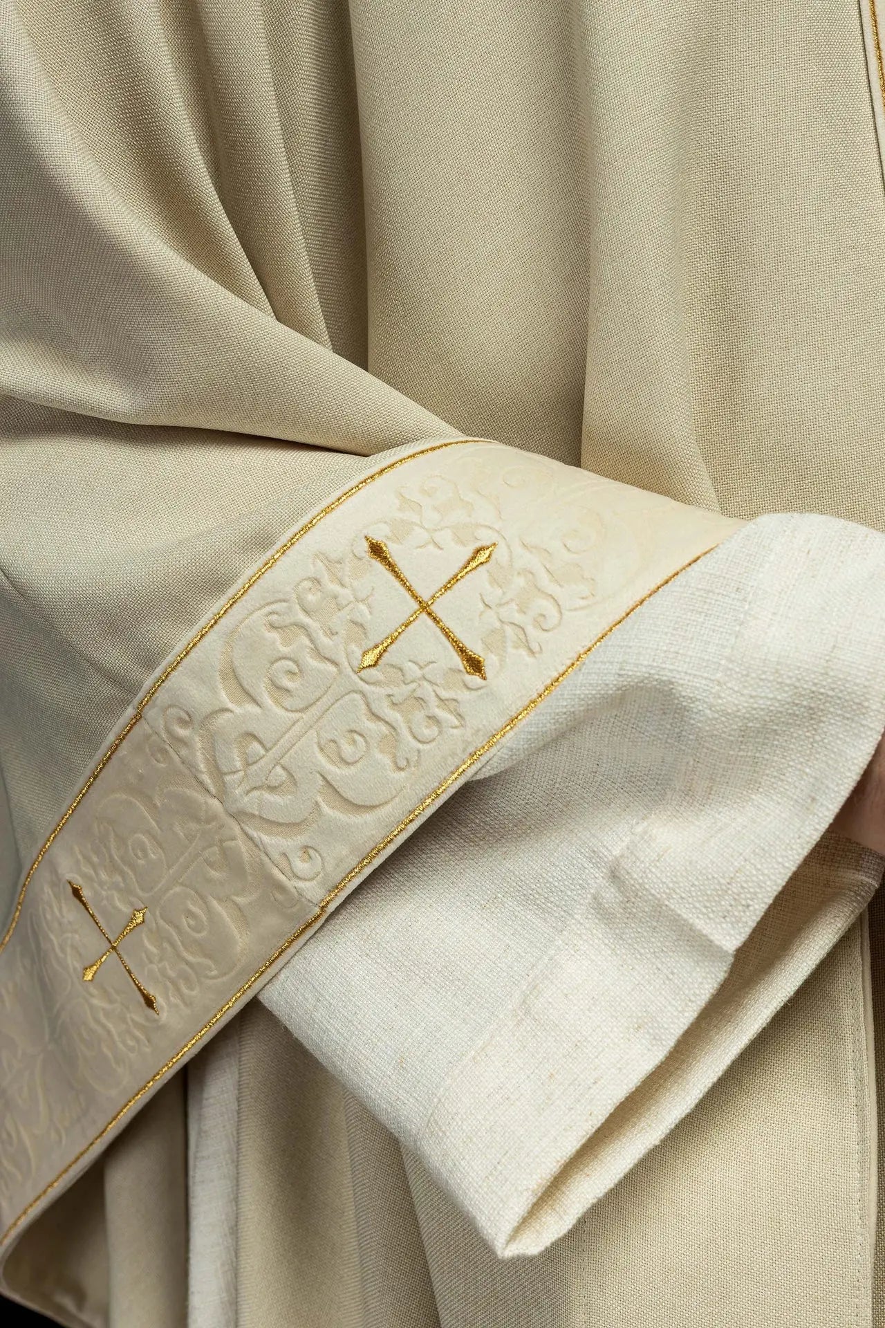 Chasuble in ecru color with an embroidered band and collar decorated with crosses