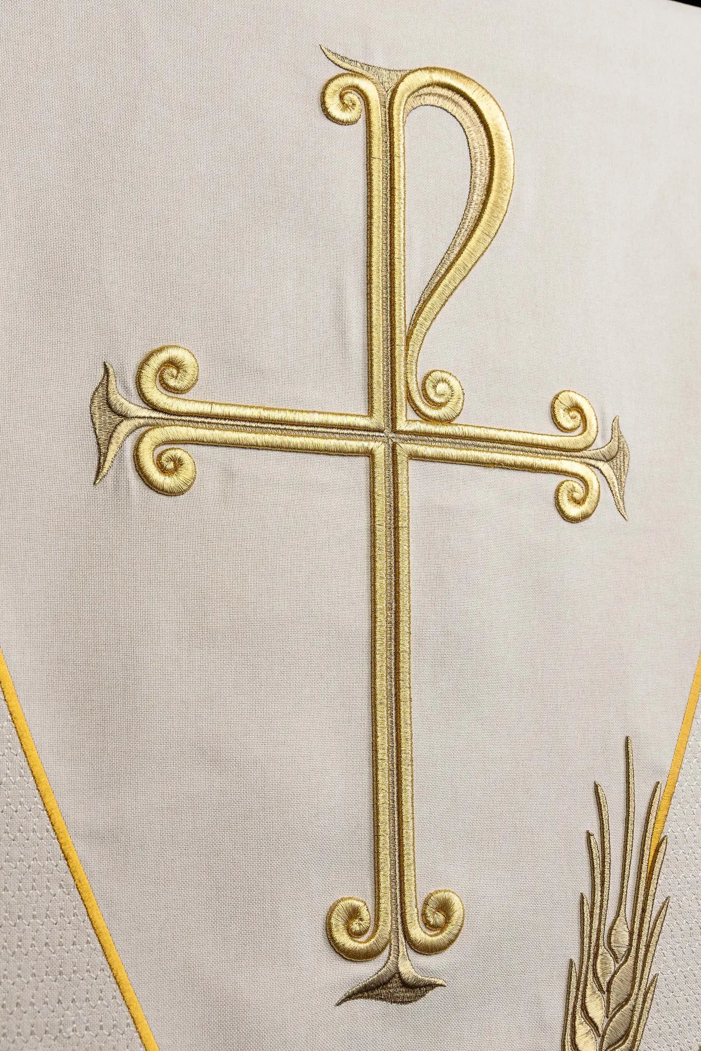 Ecru lectern cover with gold embroidered Chi-Rho symbol (cross with P) and wheat sheaves, suitable for liturgical use.