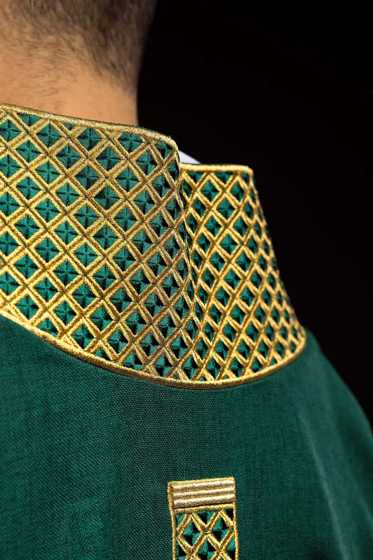Green dalmatic with embroidered crosses and collar
