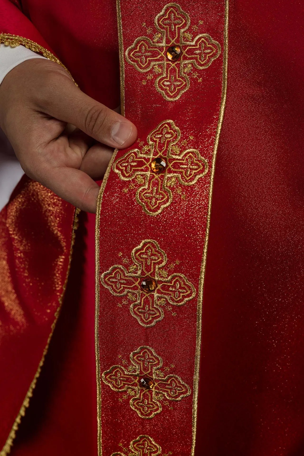 Chasuble in red with embroidered belt and collar decorated with stones