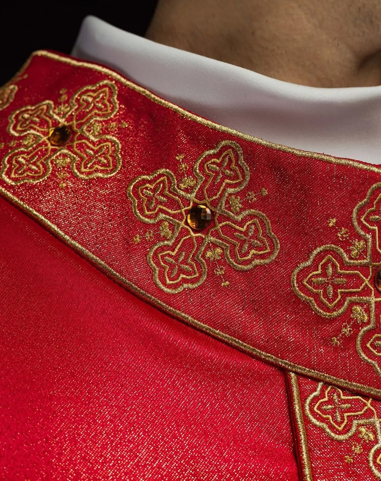 Chasuble in red with embroidered belt and collar decorated with stones