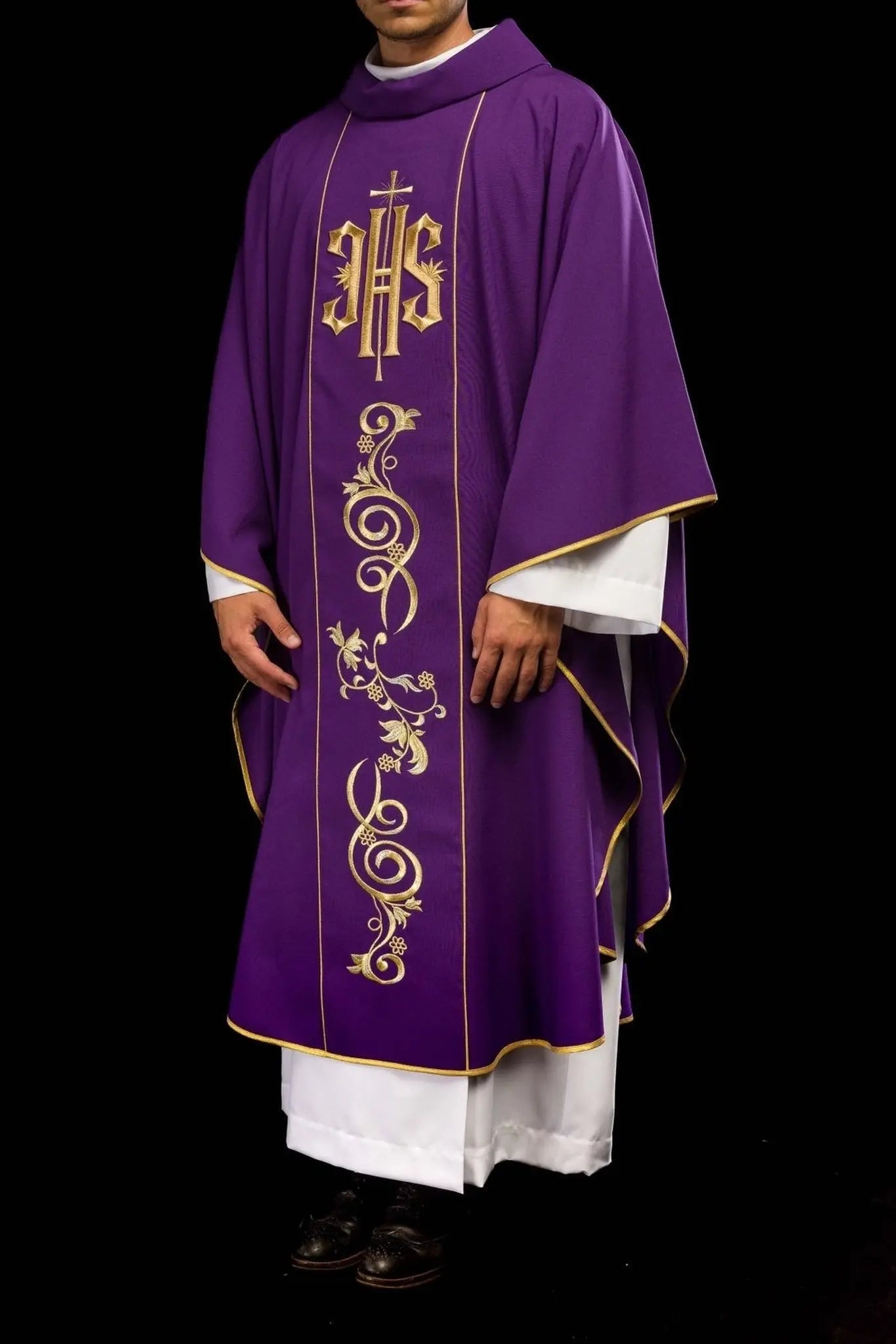 Richly decorated purple chasuble with gold motif and wide IHS band