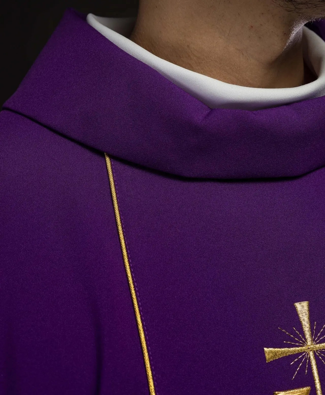Richly decorated purple chasuble with gold motif and wide IHS band