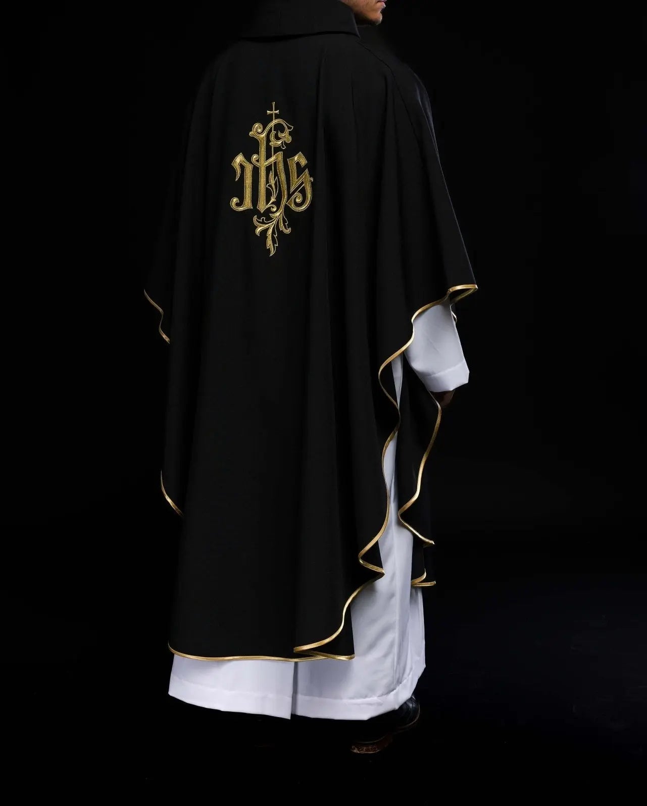 Black chasuble embroidered with IHS